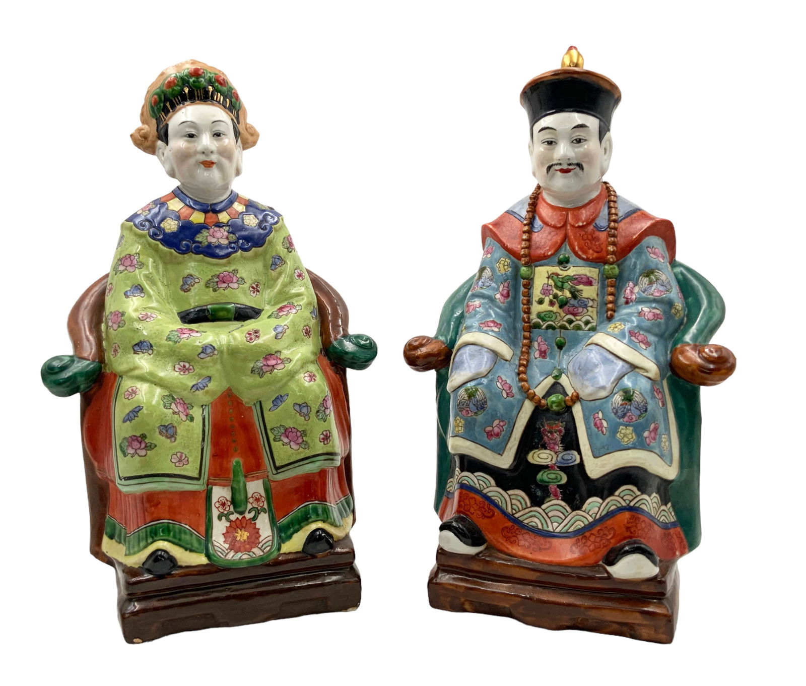 Pair of Chinese Famille Rose Man & Woman Figurines: These Porcelain Figurines are in good Overall Condition. The Lady has a Paint Imperfection (as in, lack of paint) on her Lower Left Hand Side. The man Figure measures 14 1/2" Tall. The Lady Figure mea