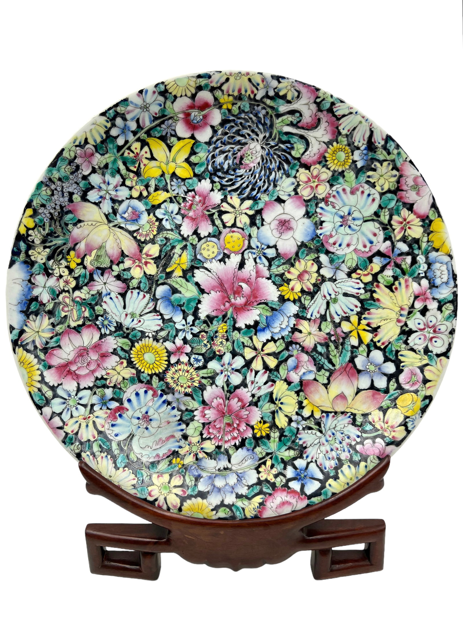 Chinese Hundred Flowers Large Plate or Charger.: This Plate has a 6 Character Mark and "Made in China" on the Underside. It is in Good Overall Condition, with some Wear to Use. It measures 13" in Diameter, and comes with a Wooden Stand. In-House Shi