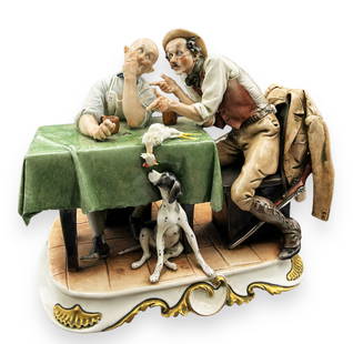 Capodimonte Figurine by Giuseppe Cappe.: This Capodimonte Giuseppe Cappe Figurine is titled "Hunting Tales." It appears to be in excellent condition, with no visible chips or cracks. It measures 8 1/2" wide, 7" deep, and 8 1/2" tall. In-Hous