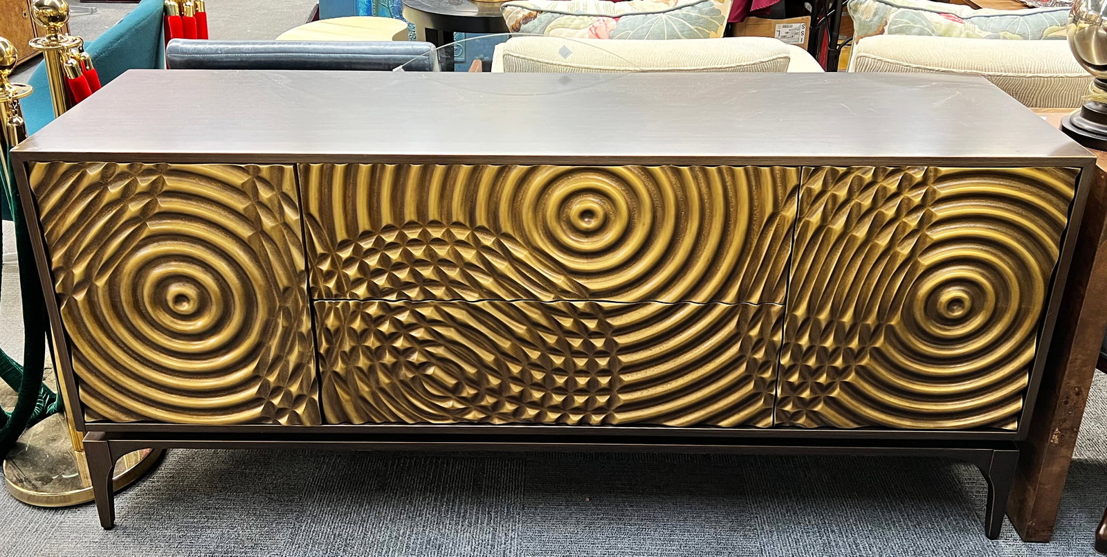 John Richard Sideboard with Ripple Design.: This John Richard sideboard has a beautiful gold ripple design covering its two drawers and two doors. The top and sides of the sideboard feature a bronze finish. The drawers and doors are opened by a