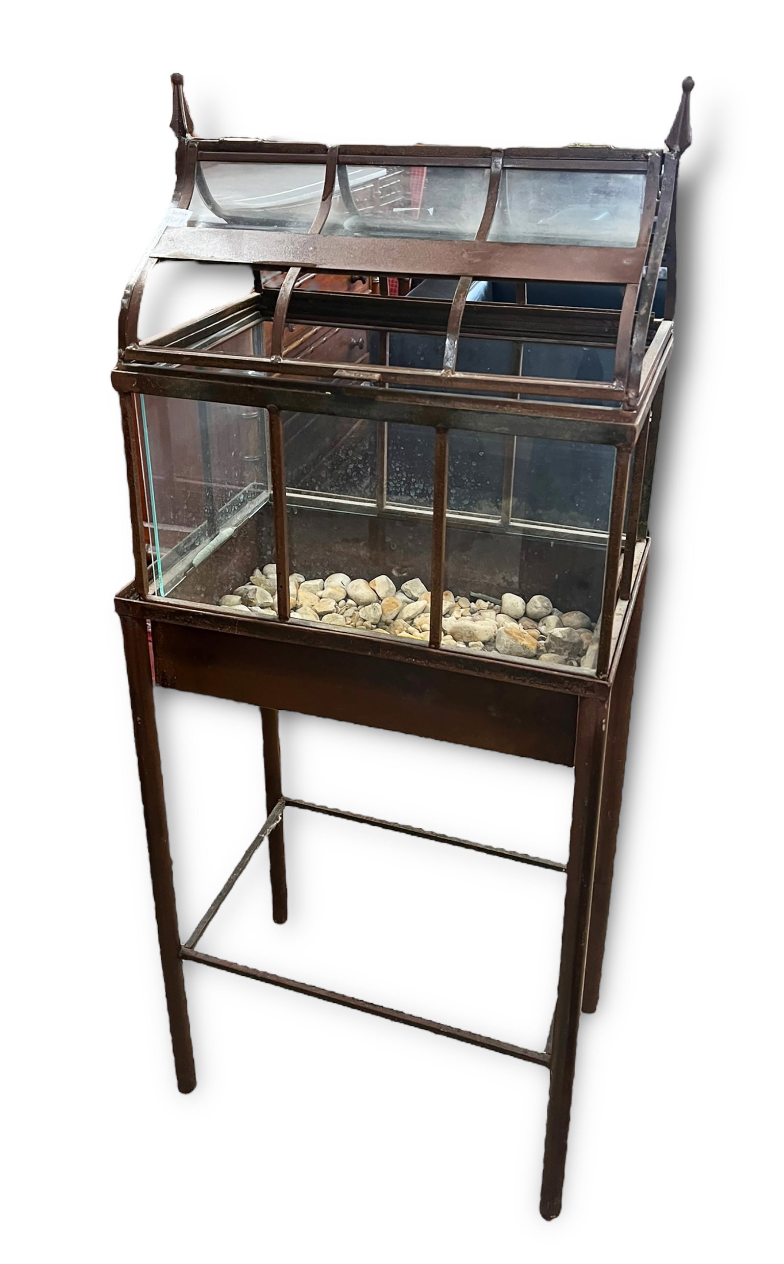 Vintage Glass Terrarium with Fitted Base.: This is a house-style vintage glass terrarium, with a small collection of stones included. The terrarium is missing six glass panels on the roof, and two panels on the sides. Besides the missing panel