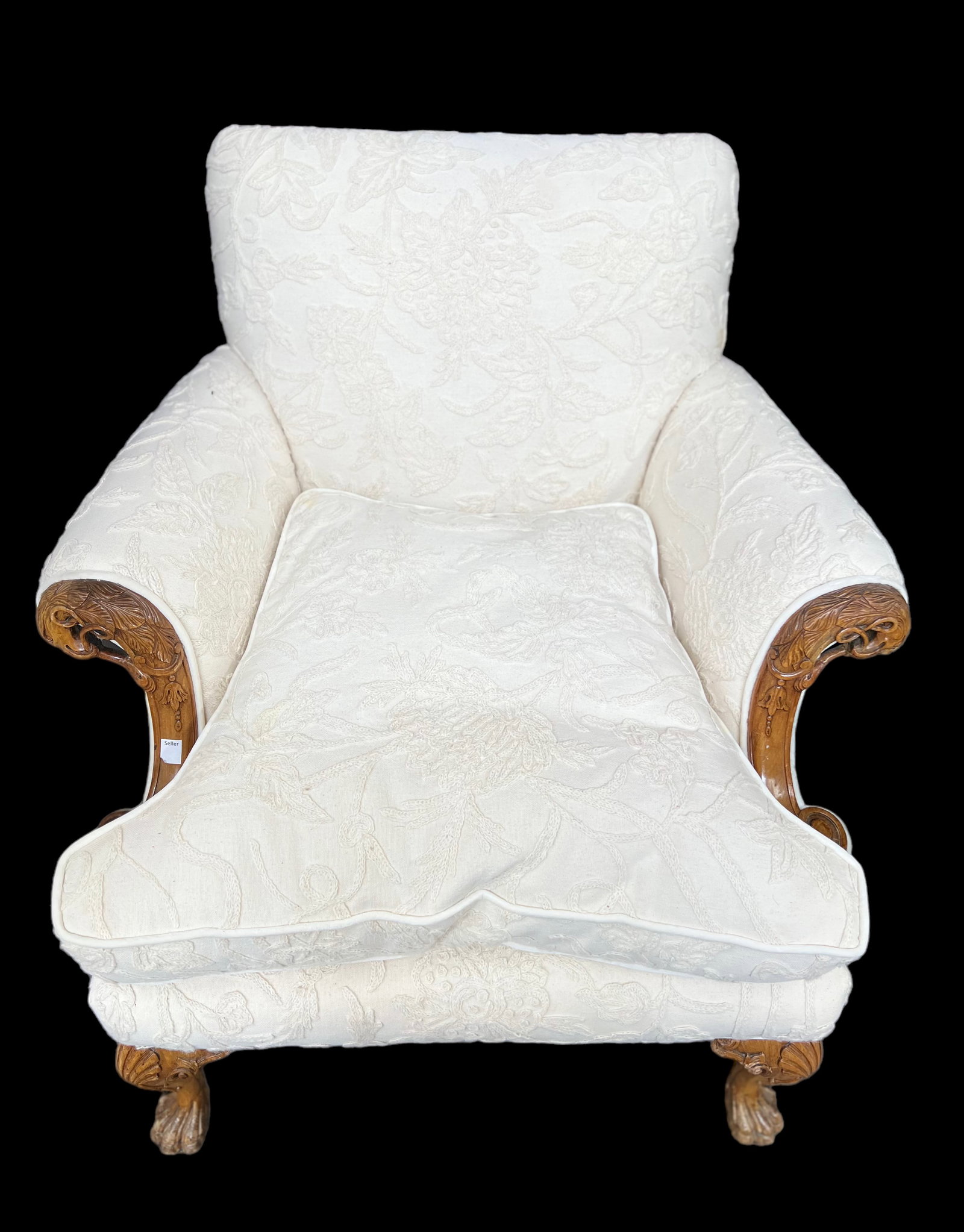 Chippendale Style Upholstered Armchair.: This is a Chippendale style carved armchair, with claw feet and cream-colored floral chenille upholstery. The deck and cushion are both stained. It measures 30" wide, 28" deep, and 37" tall. Third-Par