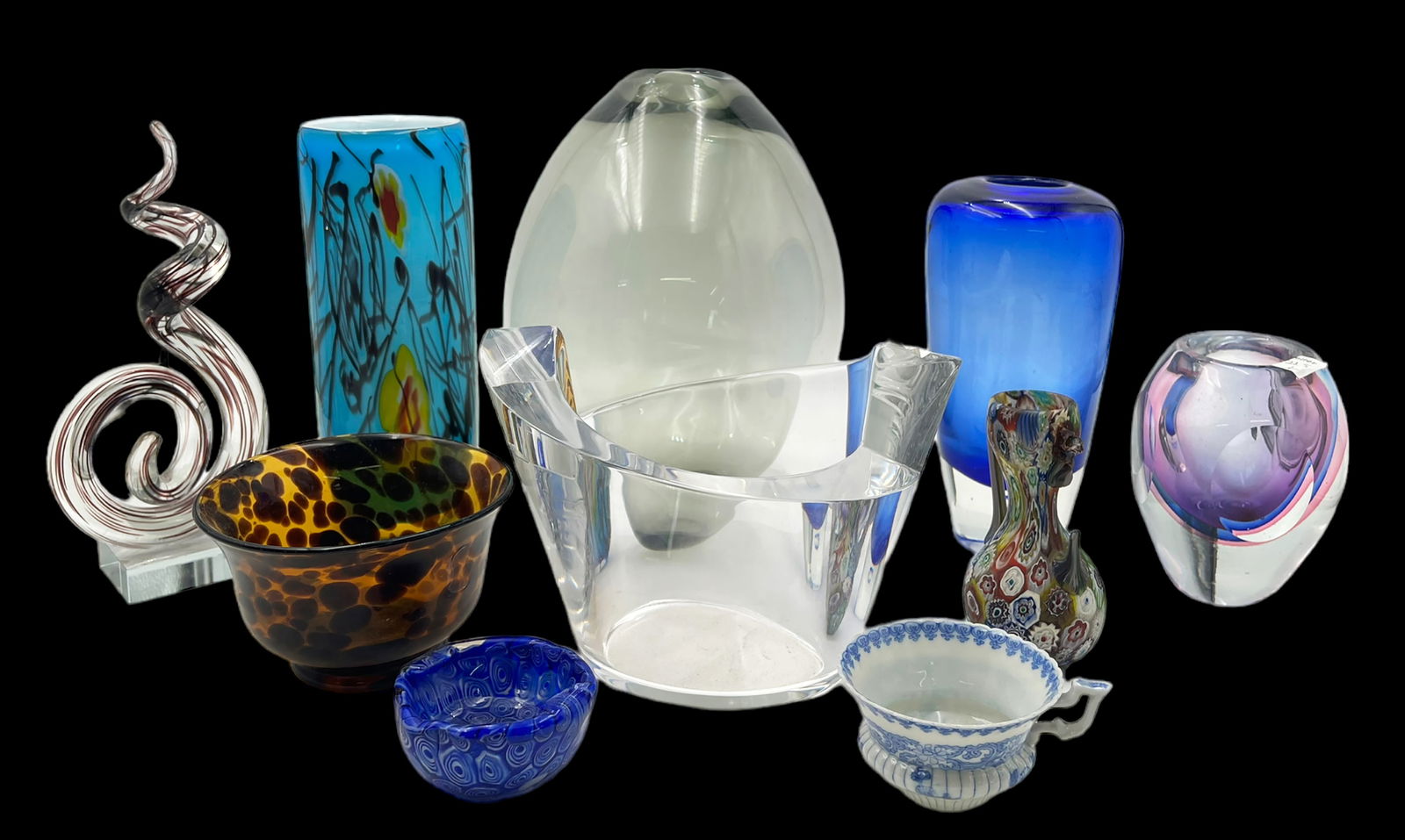 Lot: 10 Pcs., Mostly Art Glass - Orrefors, etc.: Most of the items are Unsigned. There is a clear Orrefors signed bowl, and a signed teardrop-shaped vase by Holmegaard. These two pieces look to be in Good condition; one of the smaller pieces in the