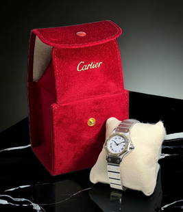 Cartier 18K & Stainless Steel Ladies' Watch.: It is an Automatic watch, and comes with Two additional Links, three Cartier Leather Pamphlets with Papers, and a Cartier Carrying Case. The Watch is Ticking, and in Good Overall Condition, with only