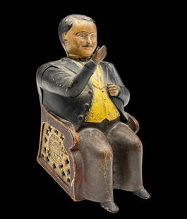 Tammany Figural Coin Bank, Dated 1878.: It is a portly man in a suit, with a space in his right hand to hold a coin. When his right arm is moved, the coin is dropped into his left breast pocket. There is some Paint Loss and age-related