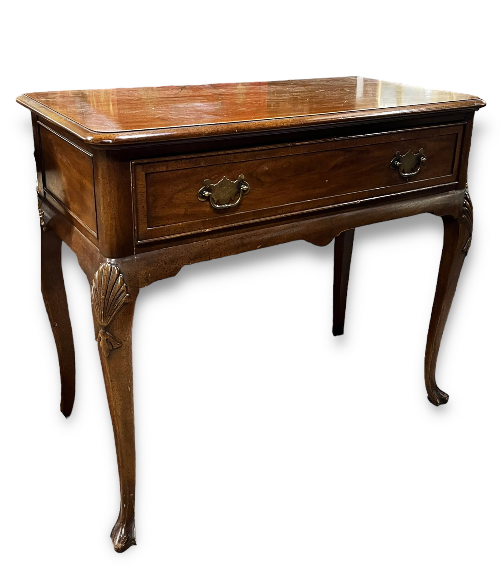 Mount Airy Mahogany Dressing Table.: This dressing table has one drawer with the original pulls. The legs are carved with a shell / leaf pattern. It is in good condition, with some scratches. It measures 36" wide, 18" deep, and 31" tall.