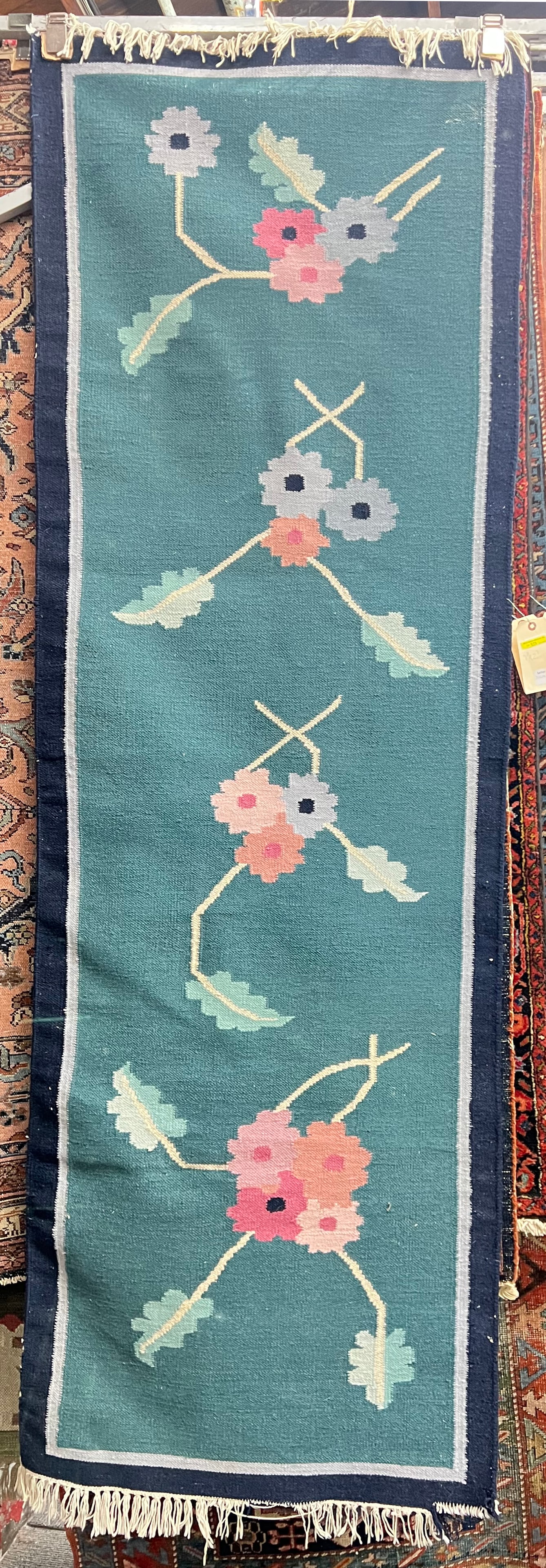 2' 7" x 7' 8" Floral Dhurri Runner Rug.: The rug has some losses in the lower right hand corner and the bottom fringe, otherwise it is in good overall condition. In-House Packing and Shipping Services are Available for this Rug. Please see o