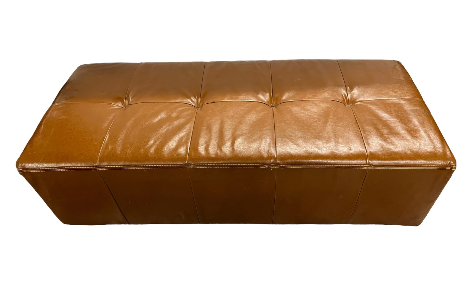 Long Brown Leather Cocktail Ottoman.: This is a leather ottoman manufactured by Palliser Furniture in Canada. The stitching is coming apart along the middle seam, but it is in otherwise good condition. It measures 54" wide, 23" deep, and 