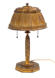 Tiffany Studios Favrile Fabrique Linenfold Lamp.: This gilt bronze lamp has favrile fabrique glass panels and mother of pearl inlay. The shade is impressed "Tiffany Studios .N.Y. 1928". The smaller, adjacent impression reads "Tiffany Studios", with