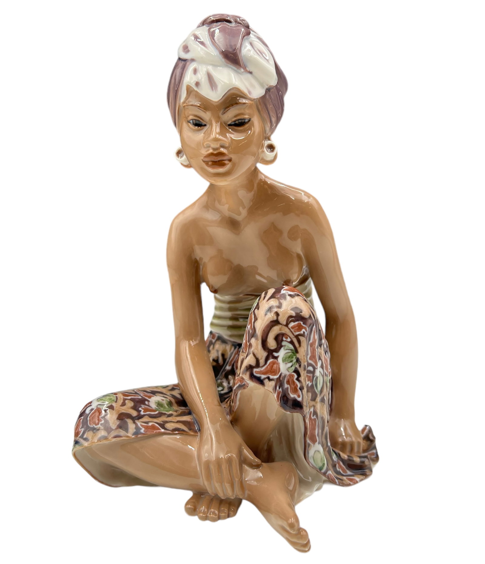 Dahl Jensen Copenhagen Figurine- Balinese Woman.: This DJ Copenhagen figurine is signed on the underside. It is of a partially nude Southeast Asian woman with a brightly colored skirt and a two-tone head scarf. The figure is in Very Nice cosmetic con
