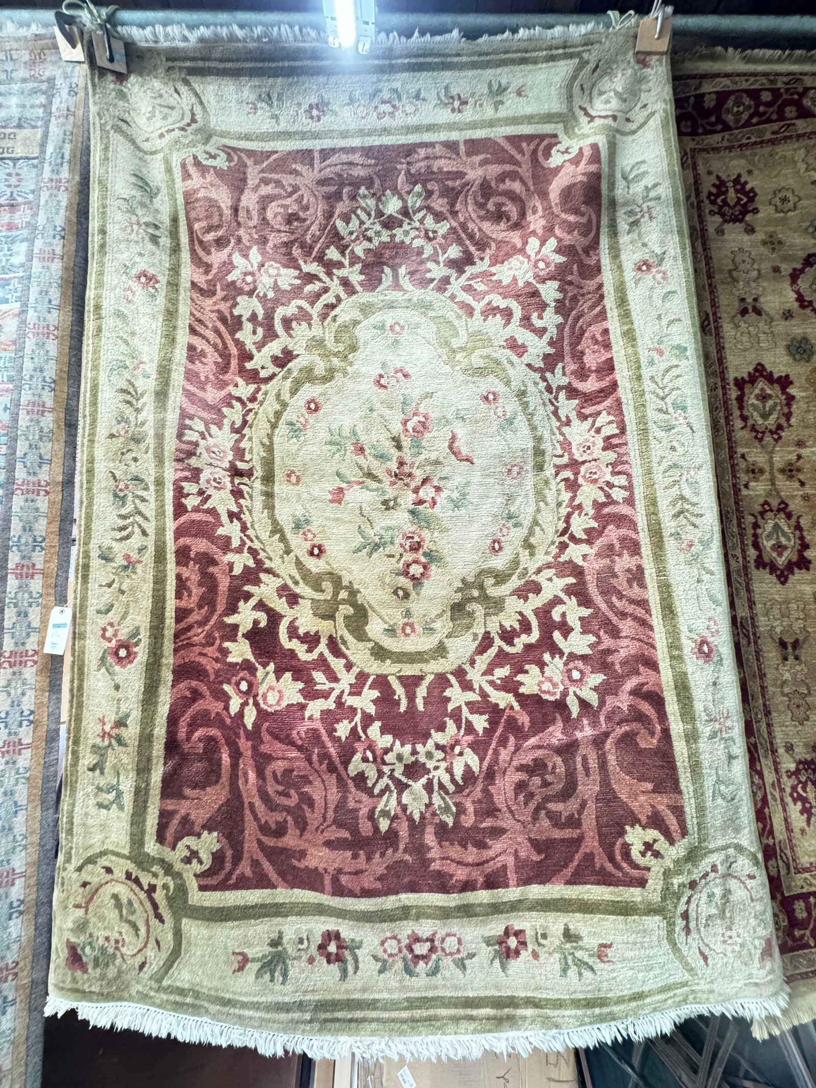 6' 1" x 8' 10" Hand-Knotted Rug w/ Floral Center.: The Rug looks similar to an Agra Rug. It looks to be in Good Overall Condition. In-House Packing and Shipping is Available for this Rug. Please See our Website Regarding In-House Shipping Procedures.