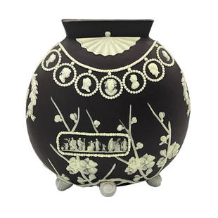 Unusual Wedgwood Jasperware Vase.: The underside is stamped, "Wedgwood". It has a cocoa colored exterior, and is decorated with cameo portraits, cherry blossom branches, and Grecian style scenes. There are four little ball feet that ar