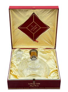 Baccarat Remy Martin Cognac Bottle w/ Red Box.: It is an empty Louis XIII Grande Champagne Cognac bottle, with both a cork stopper and a crystal fleur de lis stopper. The lot looks to be in Great condition. Bottle measures 8 1/2" tall, 6 3/4" wide,