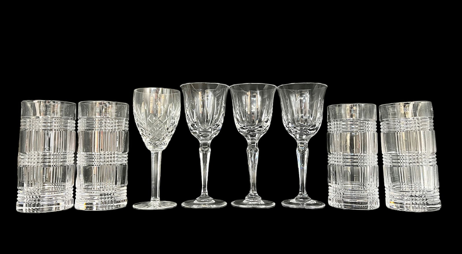 Lot of Crystal Barware- Ralph Lauren, Faberge, etc: There are 8 pieces total. Included is a set of 4 Ralph Lauren "Glen Plaid" highball cocktail glasses, a set of 3 Faberge wine glasses, and a Waterford wine glass (it appears to be the Lismore pattern)