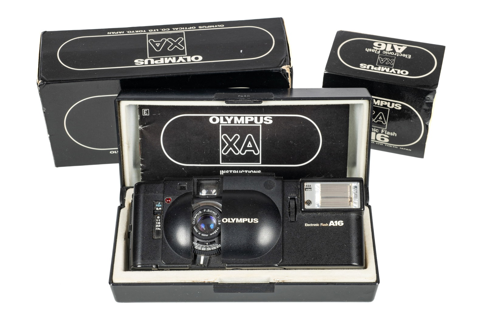 Olympus XA Camera with A16 Flash.: The camera seems to be in excellent working condition. There are no visible dents, dings, or cracks on the camera body. The shutter fires and seems to respond appropriately to different light levels. 