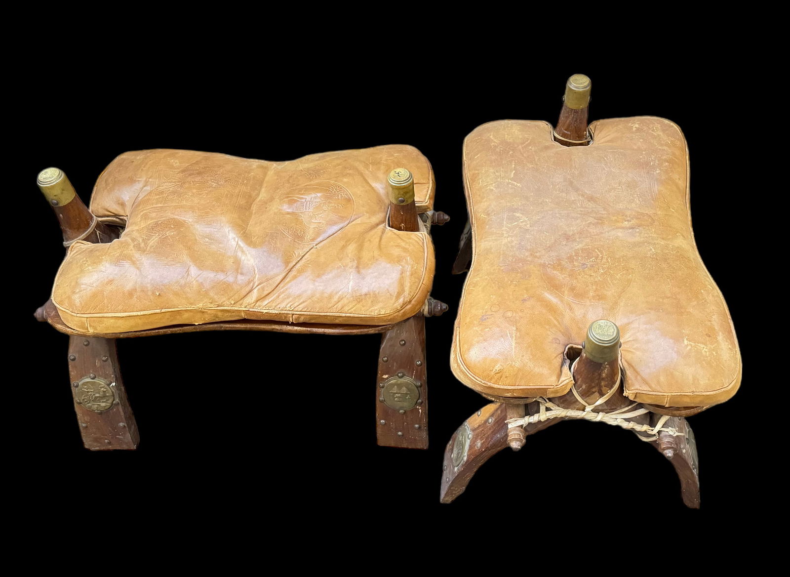 Pair of Camel Saddle Foot Stools. (1 of 2)