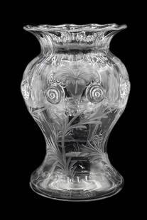 Steuben Clear Glass Intaglio Vase w/ Flowers.: It appears to be Unsigned. It is a wavy rimmed vase decorated with flowers, leaves, and swirls. There are a few small Blemishes on the body, but overall it looks to be in Nice condition. It Measures 8