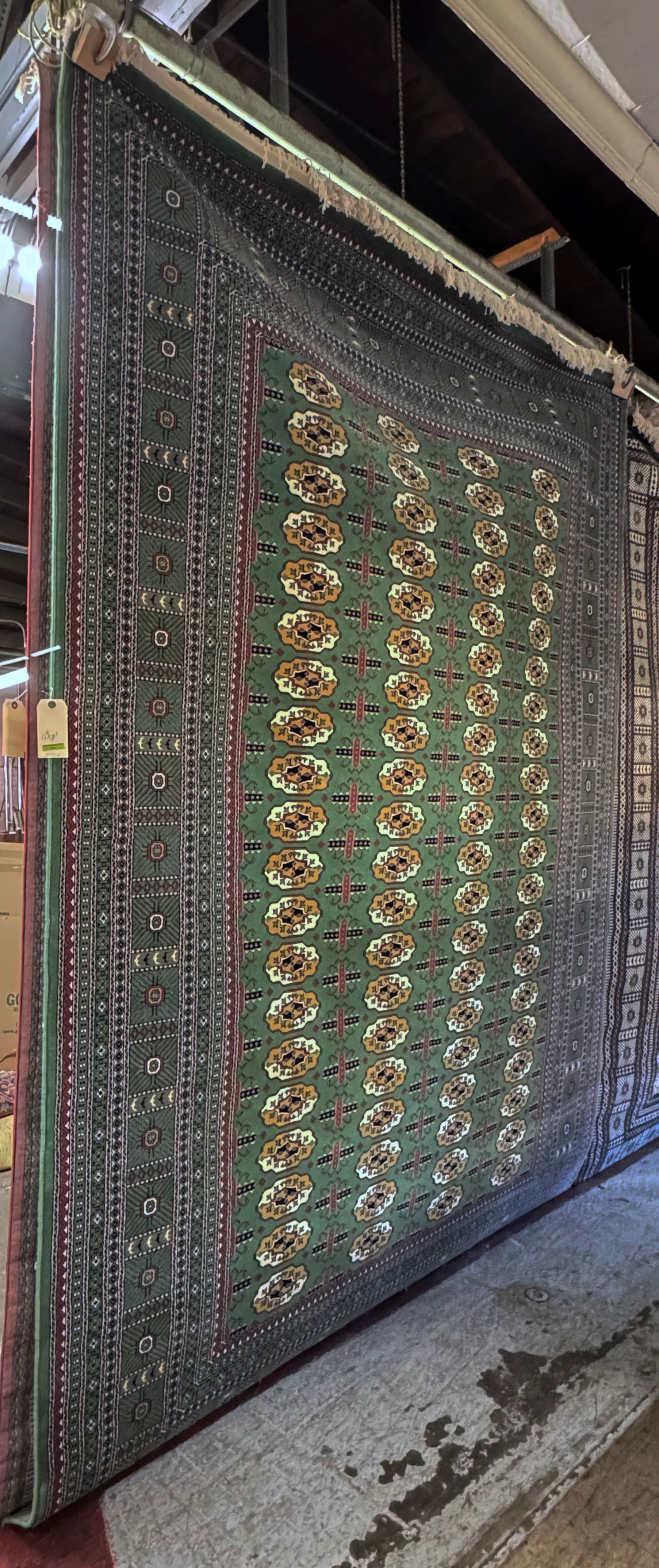 Signed Hali Green Field Bokhara Pattern Rug. (1 of 2)