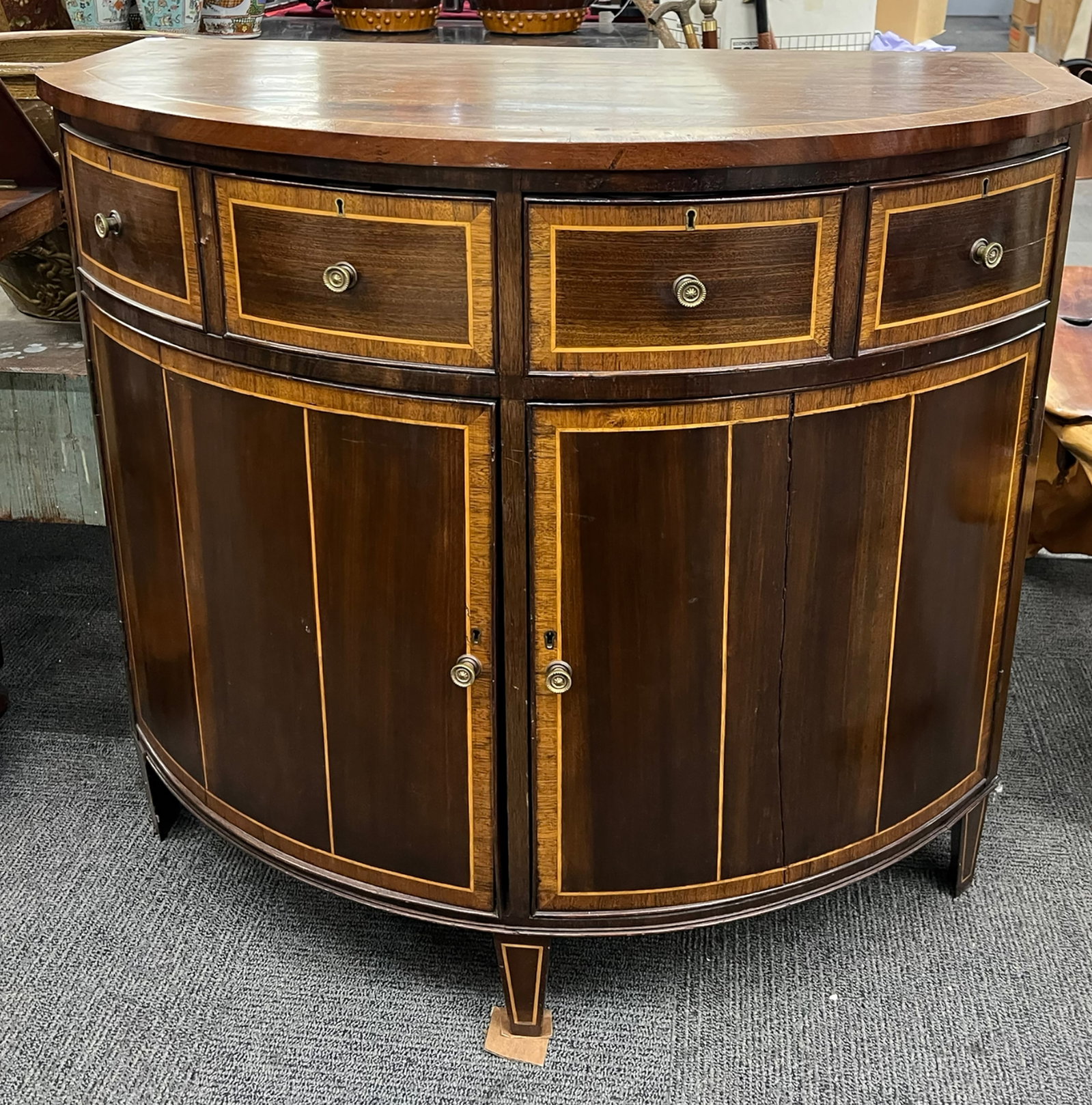 Older Banded Demilune Cabinet.: One of the bottom front doors of the cabinet has a split that runs its entire length. The top has a few scratches. Other than that, the cabinet is in reasonably good overall condition. It measures 36"