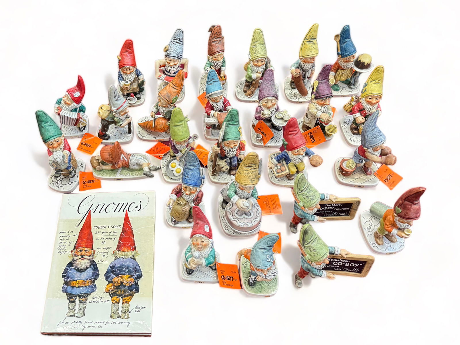 Lot of 26 Goebel Gnome Co-Boy Figurines.: Also included is a book titled "Gnomes". All of the Gnomes are in Good Overall Condition, many with the Orange Tags. The tallest figure measures 8". In-House Shipping is Available. Please See our Webs