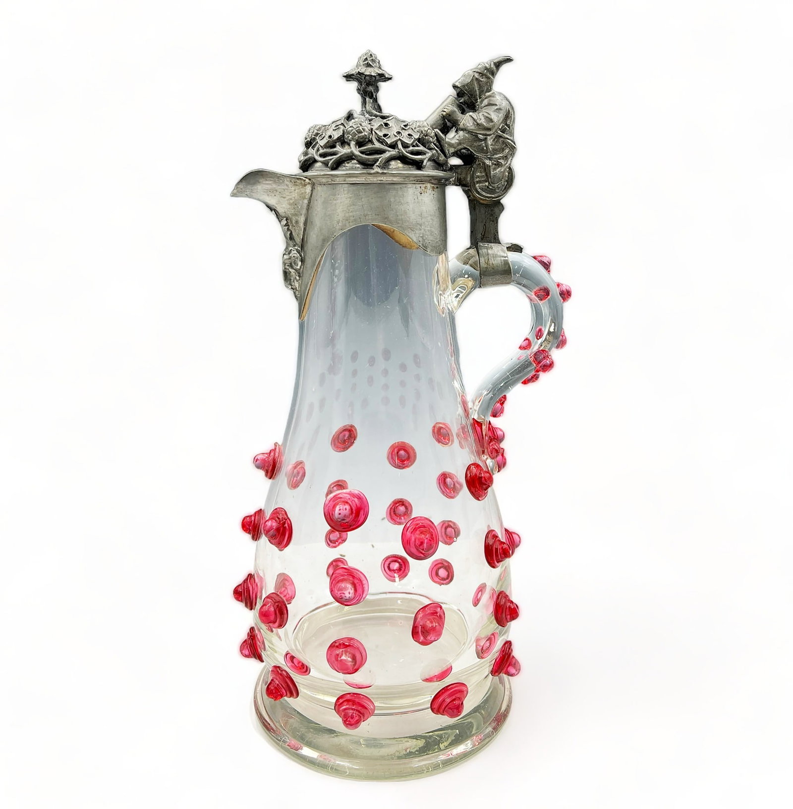 Kreitman Clear & Cranberry Art Glass Stein.: This lot consists of a circa 1880's Kreitman clear & cranberry art glass stein with a pewter lid and cranberry colored prunts. It was retailed by Eisenhanel. The lid depicts a hooded figure drinking w