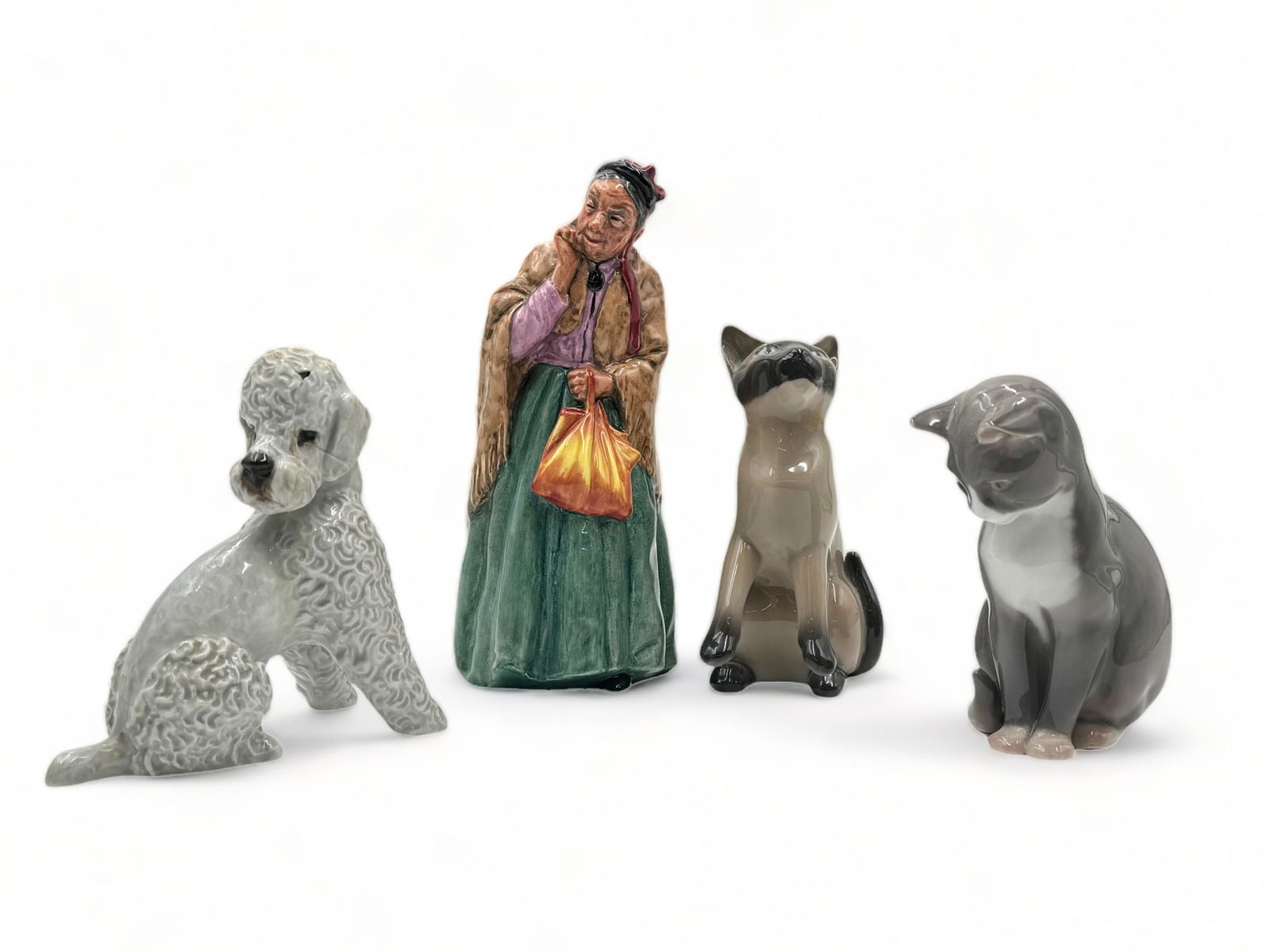 Lot of 4 Porcelain Figurines. (1 of 5)