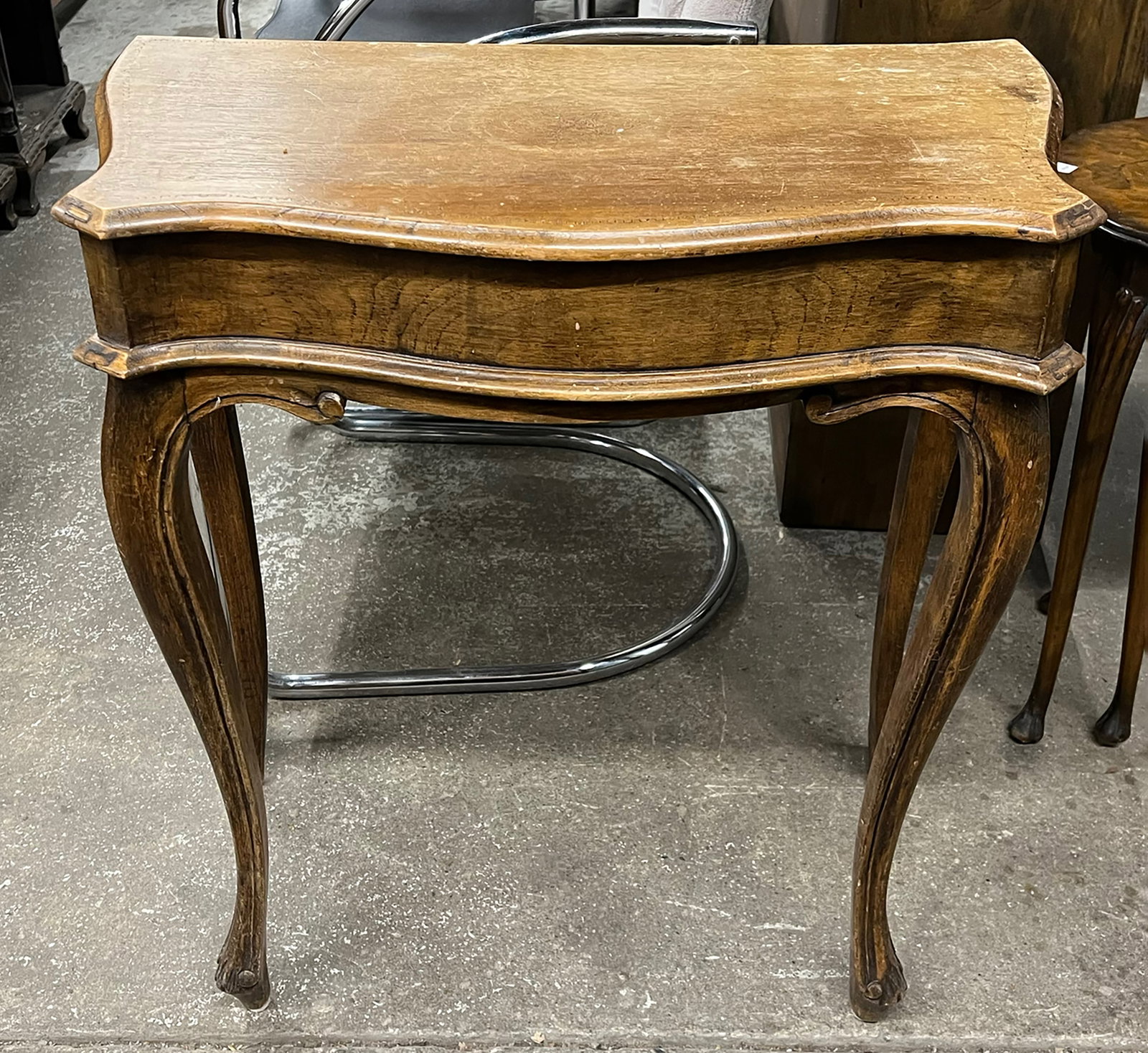 Lift Top Vanity and Sewing Table, AS IS.: This is a light wood lift top vanity/ sewing table with inner compartments. When it is opened, it has a mirror attached to the lift top. One of the hinges is loose. The top has water damage. It measur