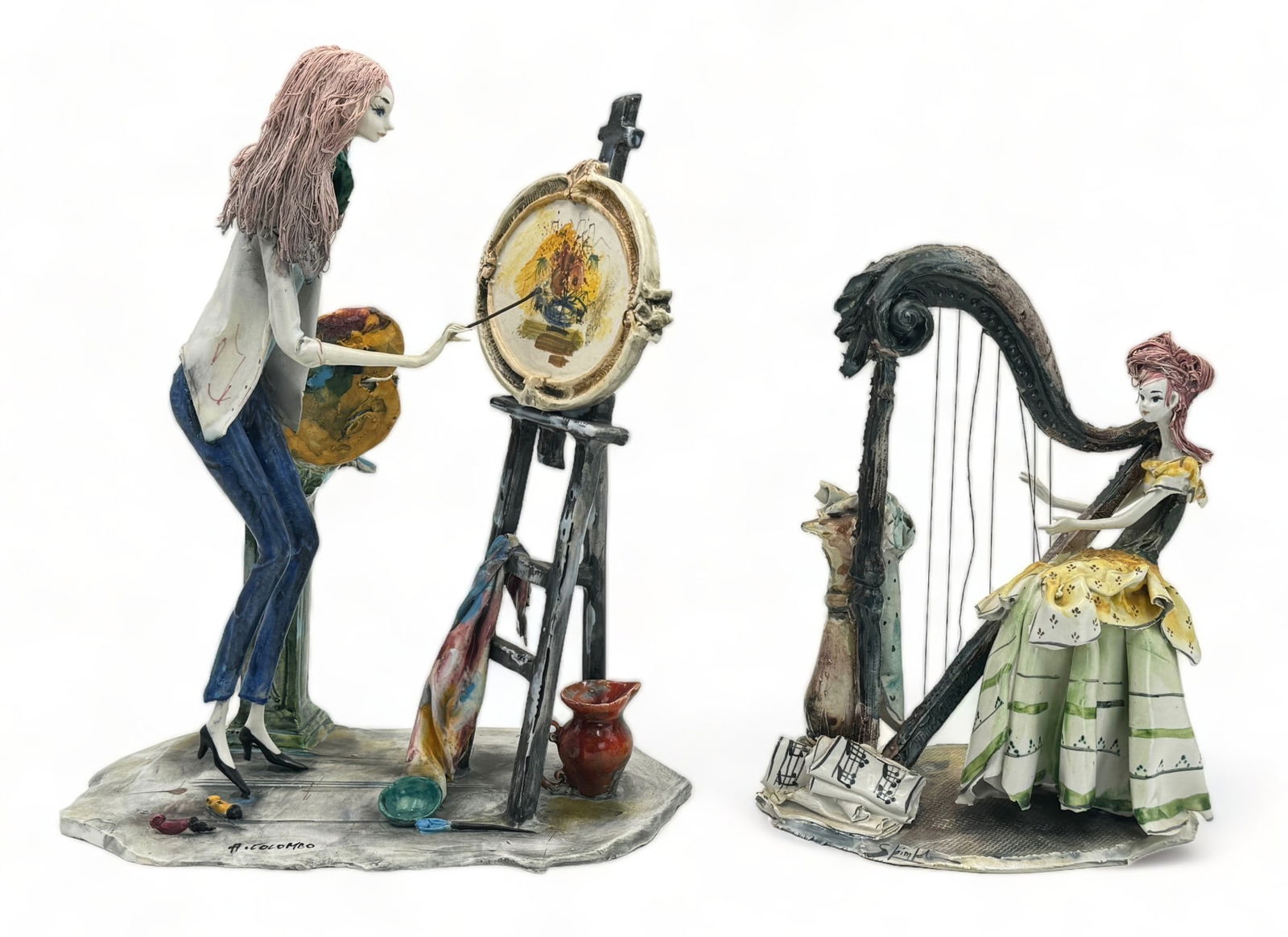Lot of 2 Artist Figurines- A. Colombo, etc.: The larger figurine is signed by artist Adriano Colombo. It portrays a woman at an easel, painting flowers. The smaller figurine is also signed, though the name is difficult to make out. It is of a yo