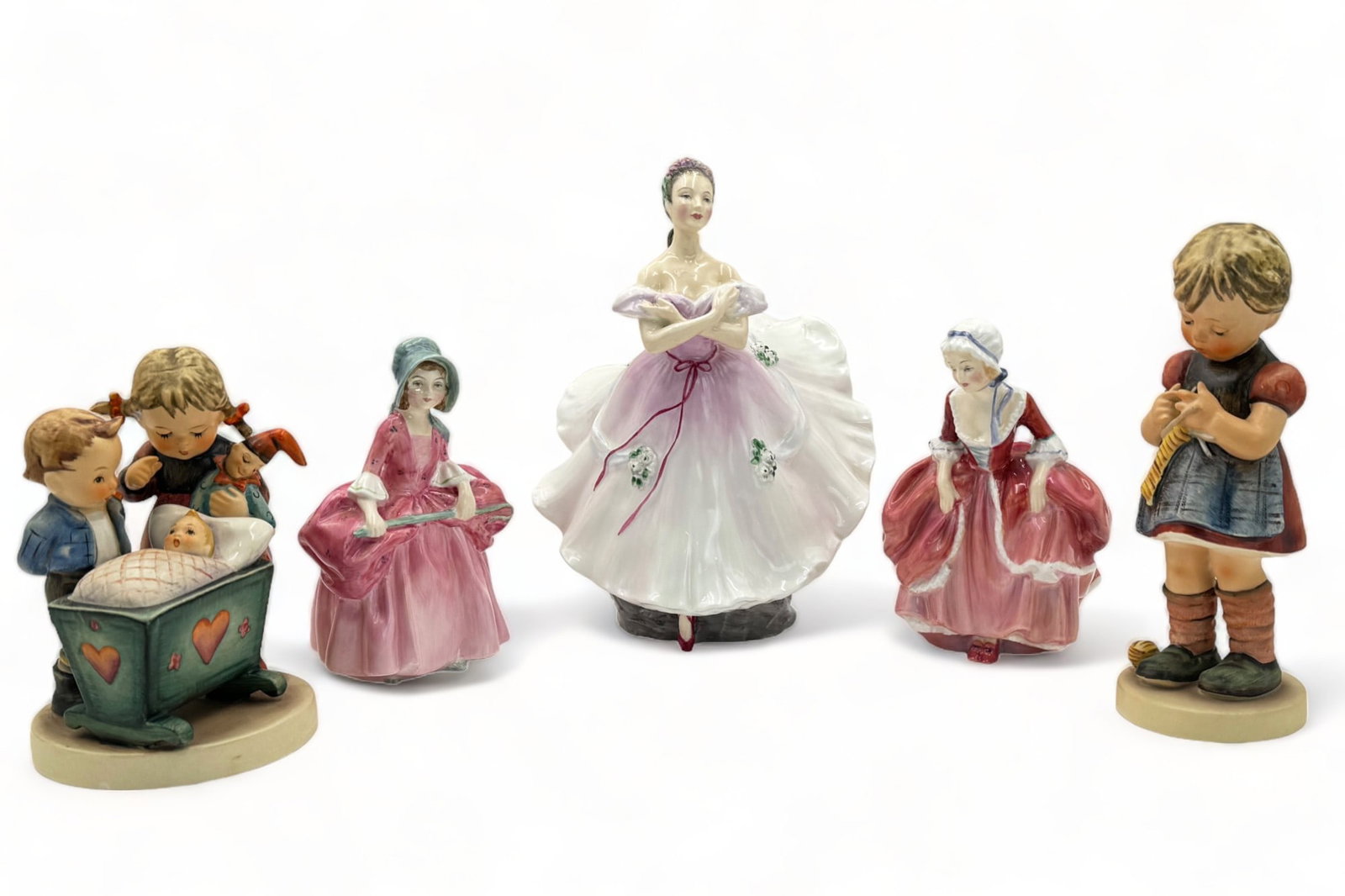 Lot of Royal Doulton and Hummel Figurines.: They look to be in overall Good condition. There is some Crazing present, and the larger Hummel figurine has a Chip on the base. The largest figurine in the lot is "The Ballerina" by Royal Doulton. Sh