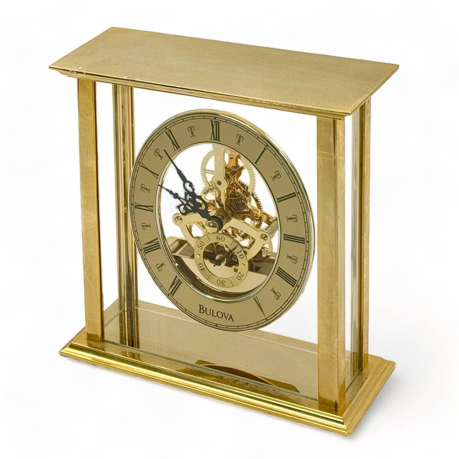 Bulova Table Top Brass And Glass Skeleton Clock. Auction