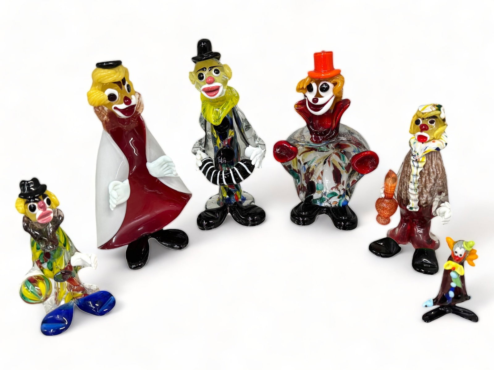 Lot of 6 Murano Style Art Glass Clown Sculptures.: They are Unsigned. One has a Chipped hand. Two of them have stickers that are quite worn and hard to read. The largest clown measures 9 1/2" tall. In-House Shipping is Available. Please see our Websit