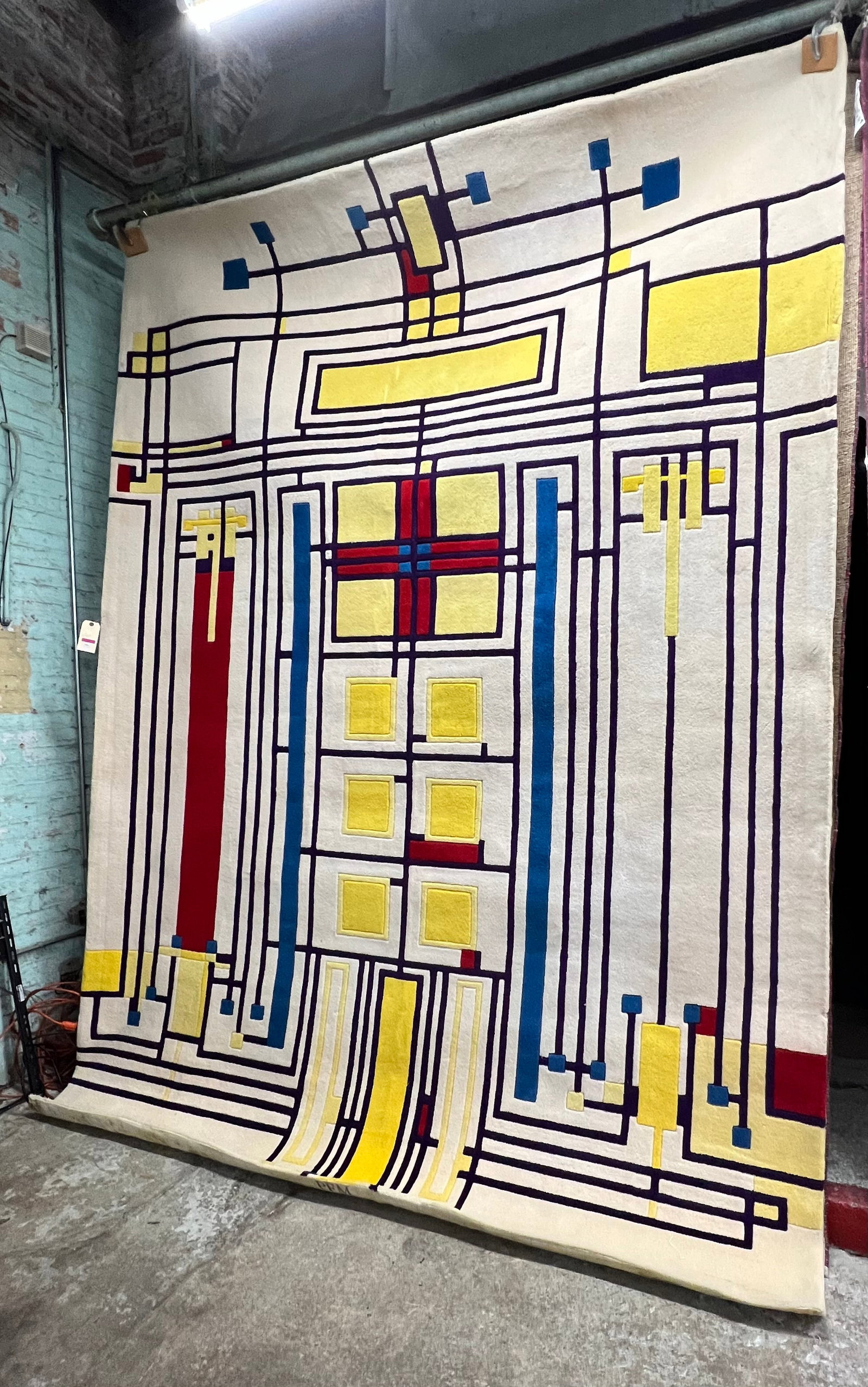 8' 11" x 11' 10" Piet Mondrian ? Rug.: The Rug is Stamped "PFM" along the edge of the of the underside, in bold letters. The Rug looks to be in good overall condition. In-House Shipping is Available for this Rug. Please see our Website Reg