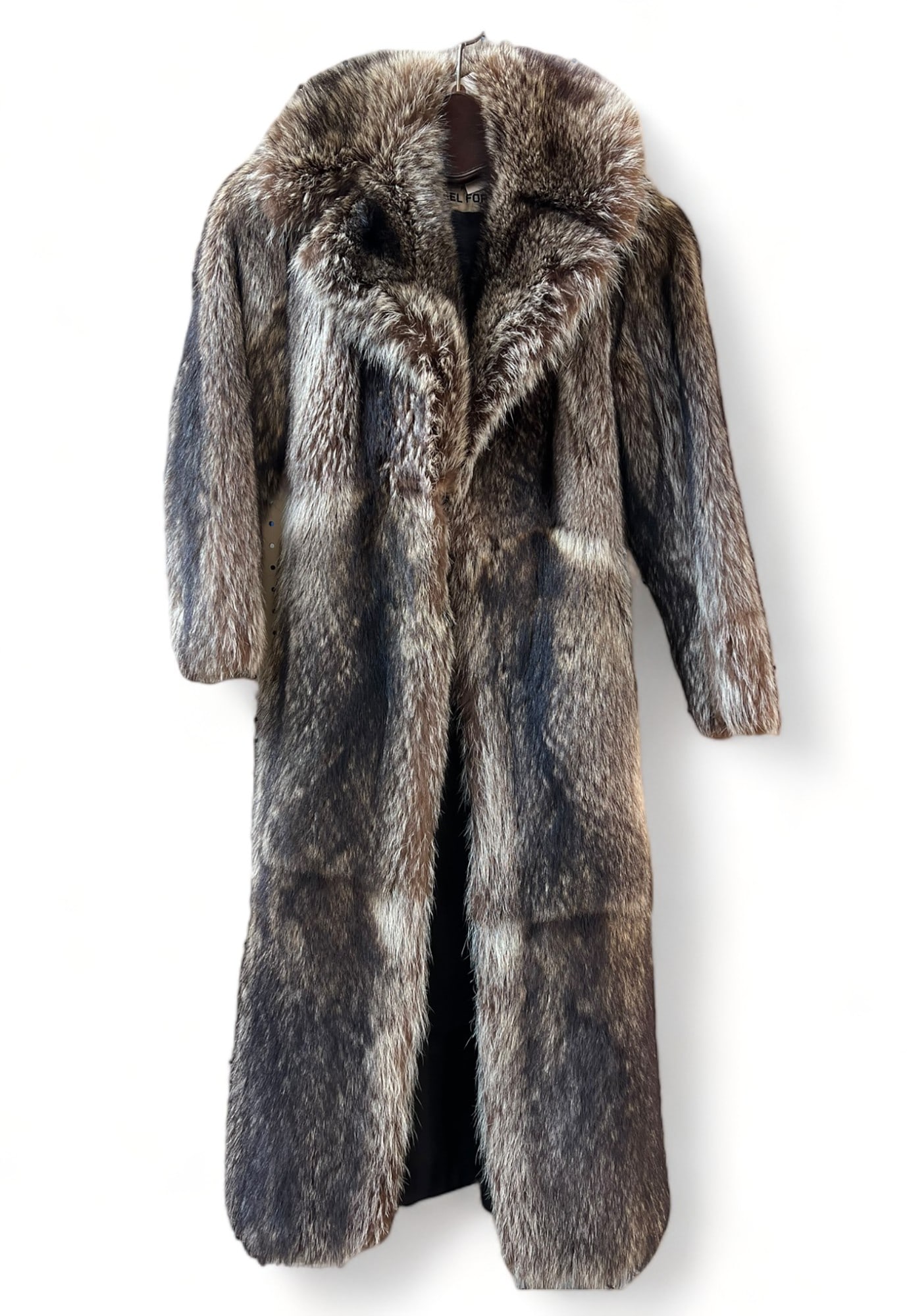 Donald Brooks for Michael Forrest Fur Coat.: It is a women's mid calf (or 7/8 length for a shorter person) fur coat, in Good condition. It is Likely raccoon fur. It is appropriate for a woman who wears a Small or Extra Small size, and who has sh