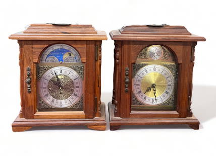 Lot of Two Mantel Clocks - One with Chimes.: There is an Emporer Tempus Fugit Battery Operated Clock (on the Right), and an Emporer Sun & Moon Dial Chiming Clock (on the Left). The working condition on these is not known. They measure 15 1/2" ta