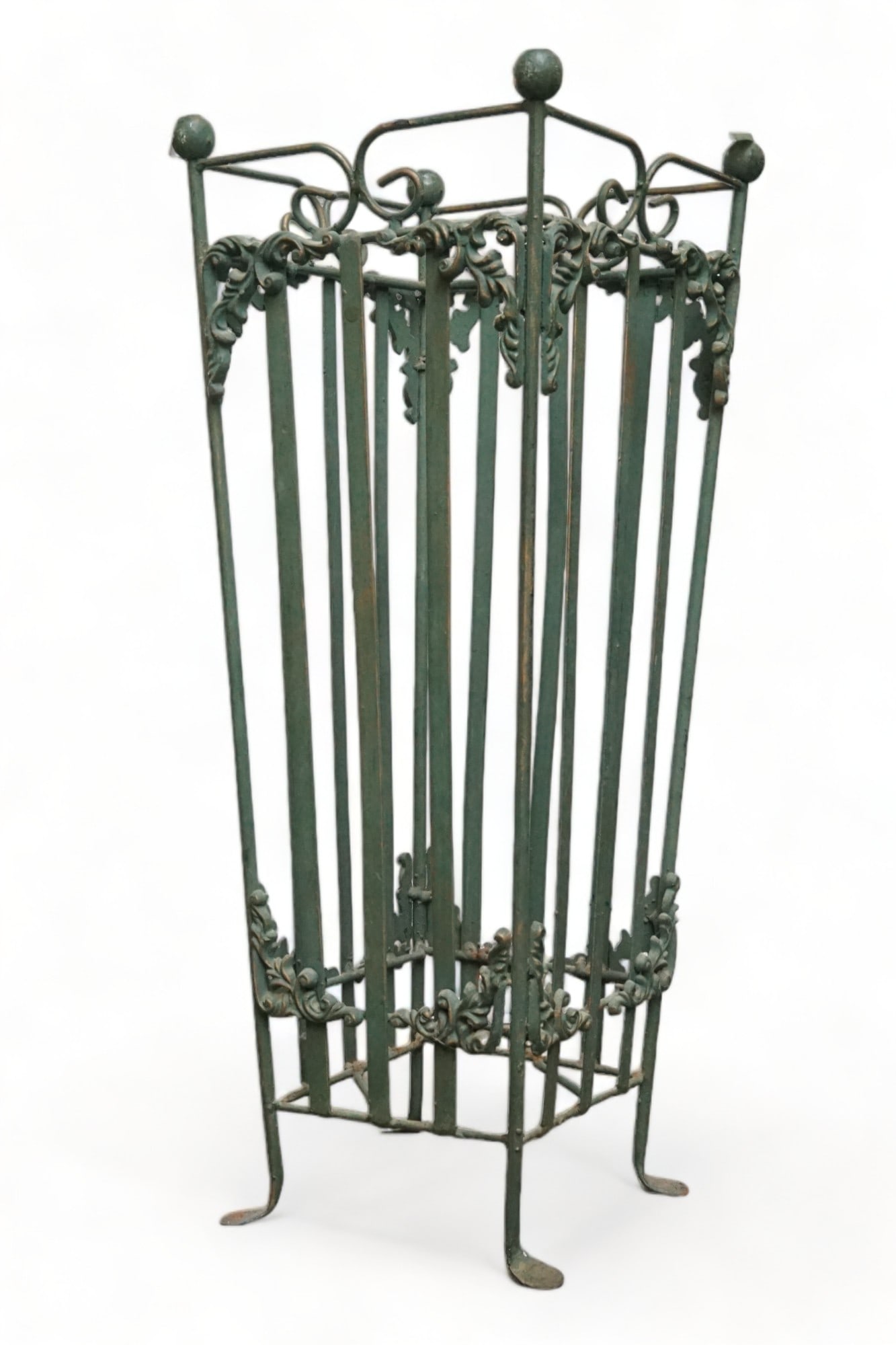 Green Metal Umbrella Stand.: This vintage metal umbrella stand has floral decorations on the top and bottom. There is some paint loss, but it is in otherwise good condition. It measures 24" tall, 9" wide, and 9" deep. Third-Party