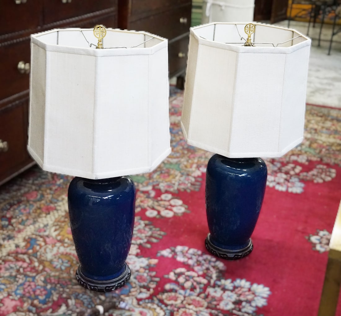 Pair of Chinese Style Lamps.: This is a pair of blue chinese style porcelain lamps. Both lamps have matching cloth shades and gold-tone asian style finials. Both lamps are working. Some cosmetic cleaning is needed on the shades. T