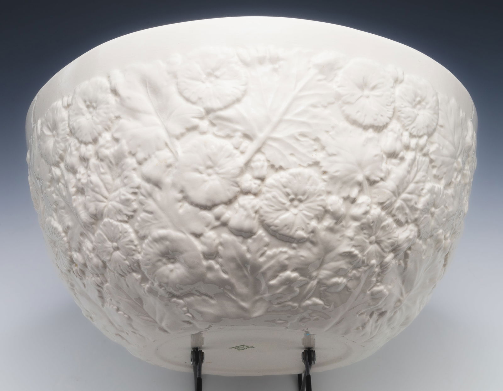 Spode White Bowl w/ Textured Flowers & Leaves.: The bowl is Signed on the underside. It Looks to be in overall Good condition, with some Crazing present. The bowl Measures 12 3/4" in diameter, and 6" tall. In-House Shipping is Available. Please See