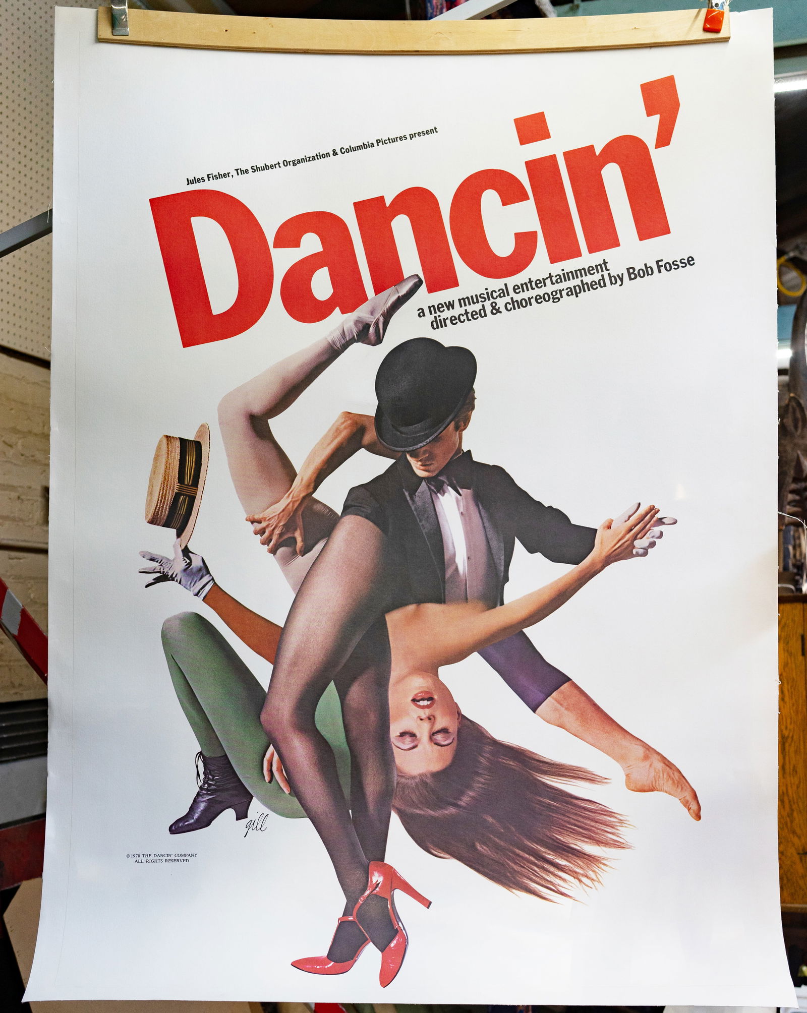 1978 Dancin' Musical Theatre Poster.: The poster has artwork by Gill and Jack Mitchell, and measures 57 1/2" x 41". It is adhered to a 100% cotton backing that provides a 1 1/2" margin for framing. There are three flea-bite sized spots on