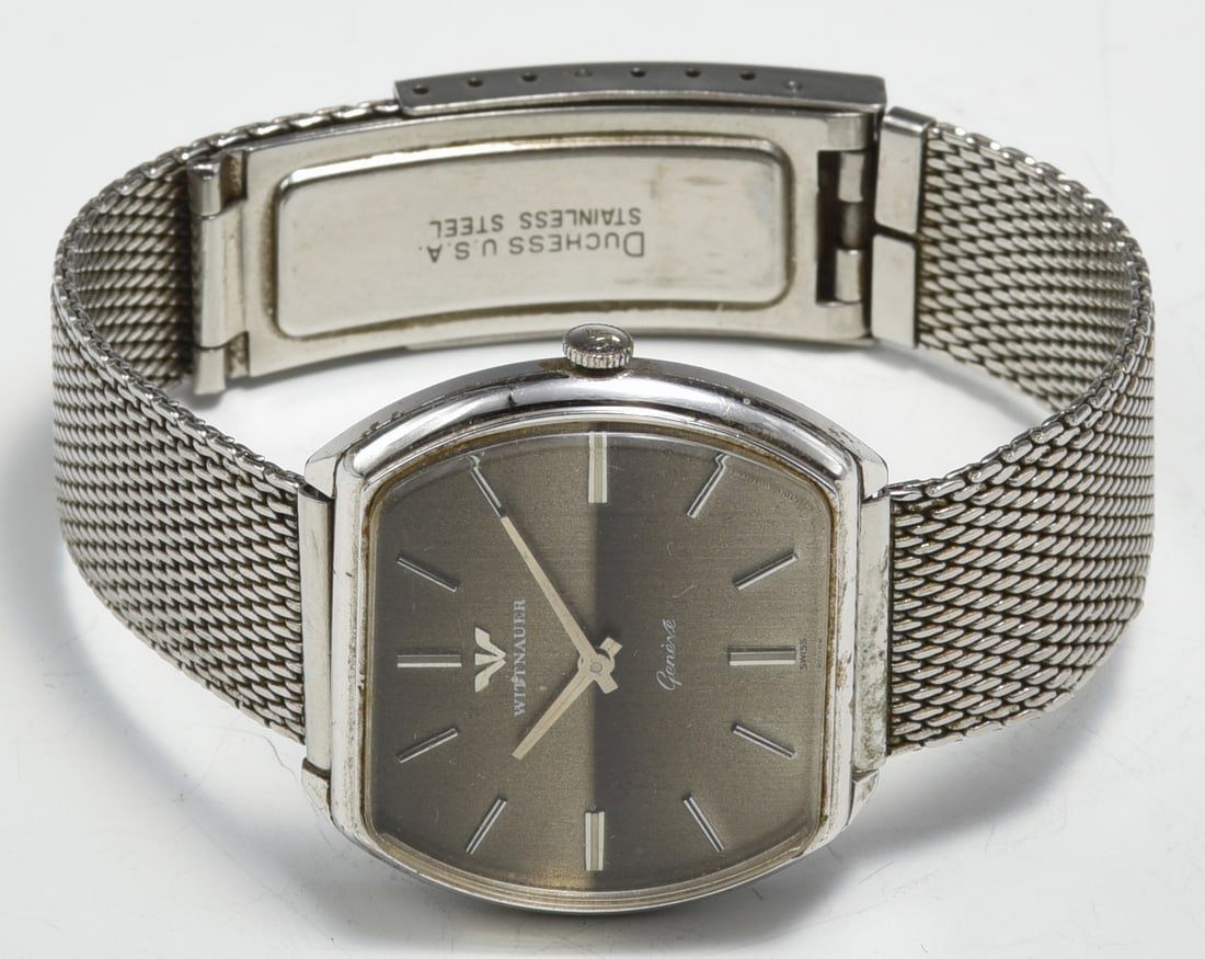 Vintage Wittnauer Geneve Stainless Men's Watch.: The Watch comes with a Stainless Steel Band. It is a windup watch, and it ticks. The watch head measures 28mm long by 33mm wide. The watch crystal has some scratches, and the case and band have some m