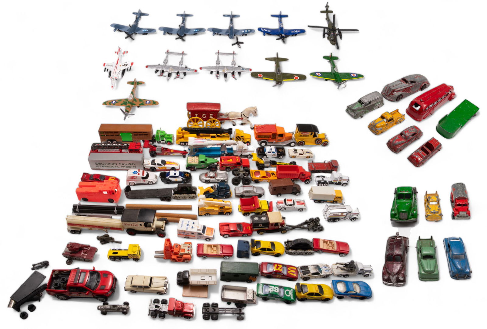 Lot: Vintage Die Cast & Toy Cars, Trucks & Planes.: This lot includes 50+ vintage (1970s and above) toy cars, many die cast. Some brands included are Hot Wheels, Lesney, Corgi, TootsieToy, Takara, and more. Some of the brands displayed on the vehicles