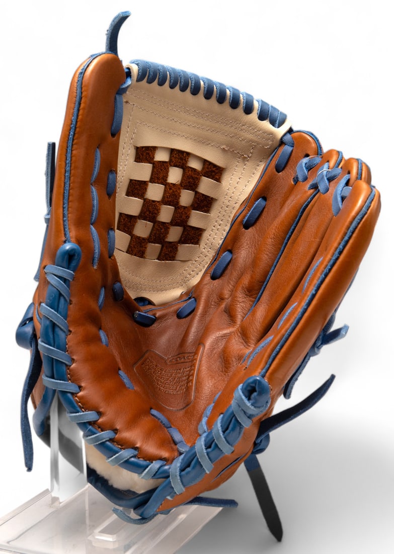 Limited Edition Coach Designer Baseball Glove.: The glove has the original retail tag still attached. It is in the colors Fawn/Parchment, with bright blue accents. The Glove is unused, and looks to be in Very Nice condition. It Measures 10 1/4" acr