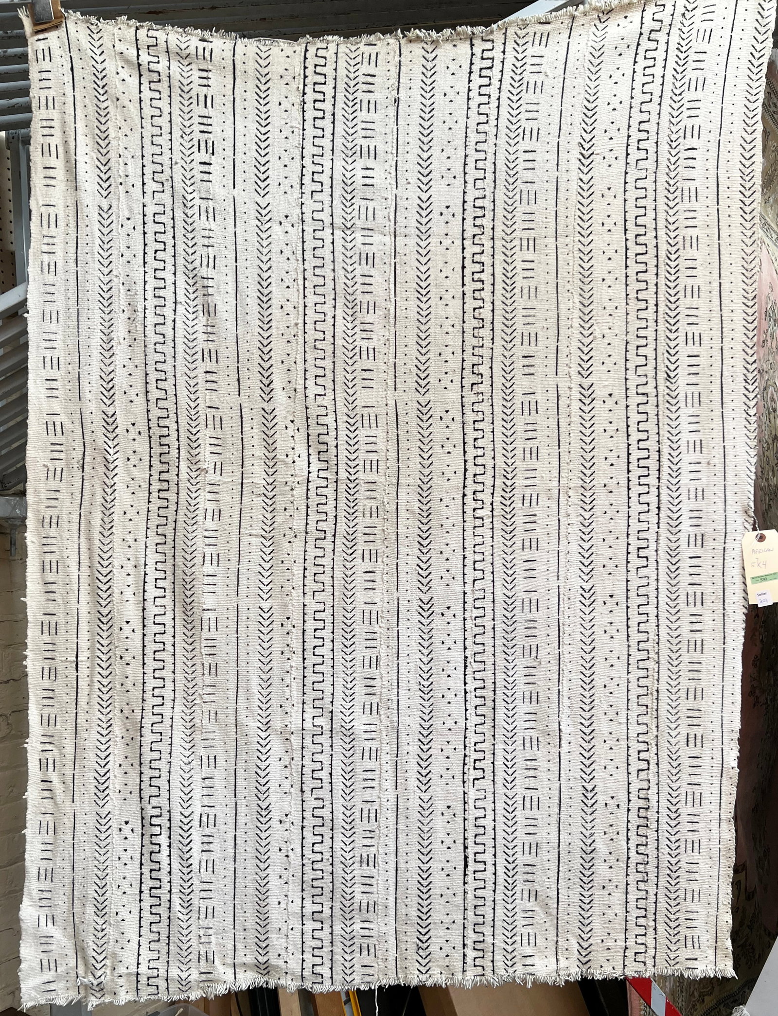 4' x 5' 7" Mali Black & White Mudcloth.: The piece looks to be in good overall condition, with some fraying at the ends. In-House Packing and Shipping is Available for this piece. Please see our Website Regarding In-House Shipping Procedures