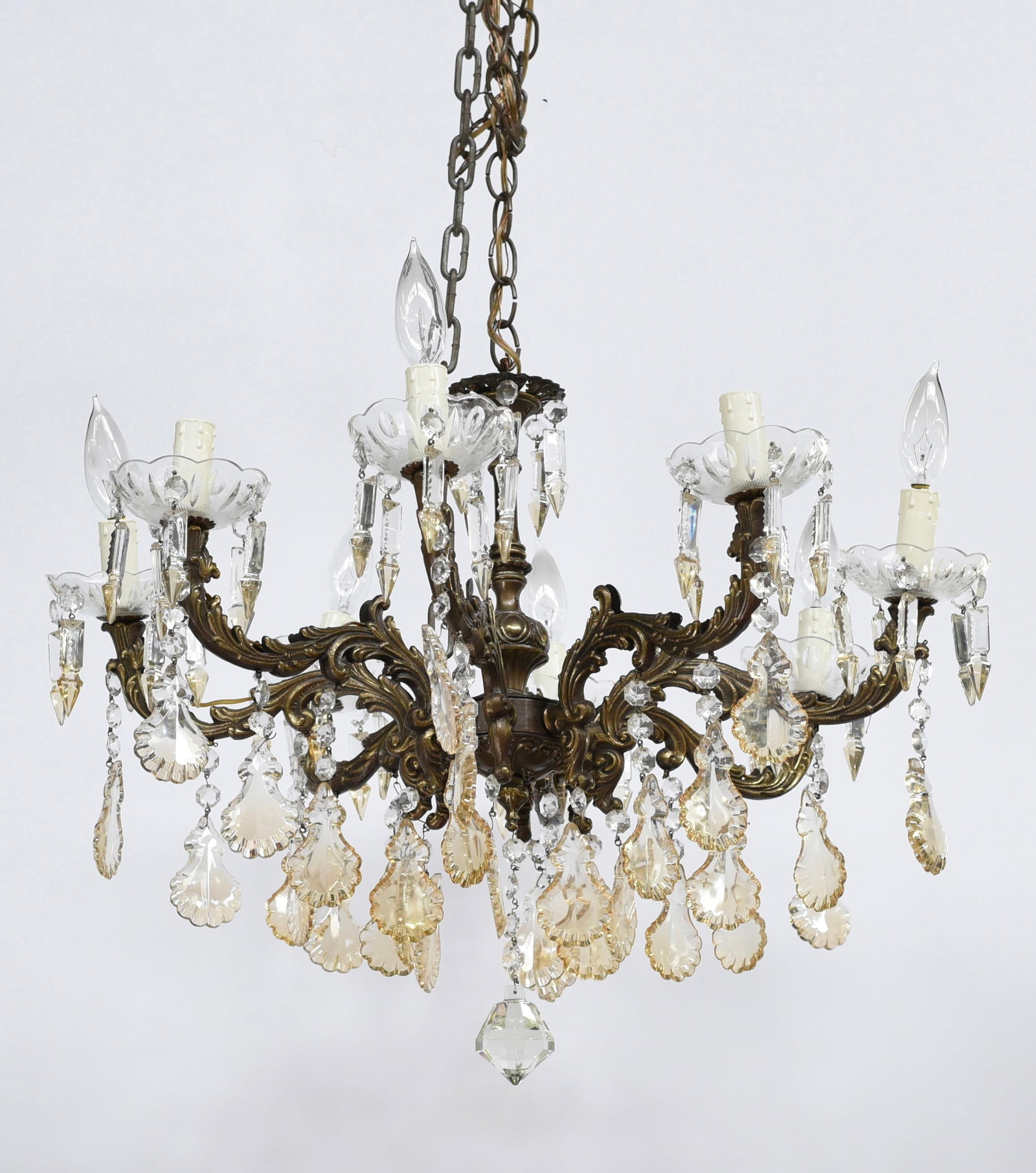 Brass Light Fixture w/ Very Ornate Crystal Prisms.: The Fixture and prisms look to be in good overall condition, and it looks to be in working order. The Fixture measures 19" long and 22" across. Third-party shipping or personal pickup is required. Ple