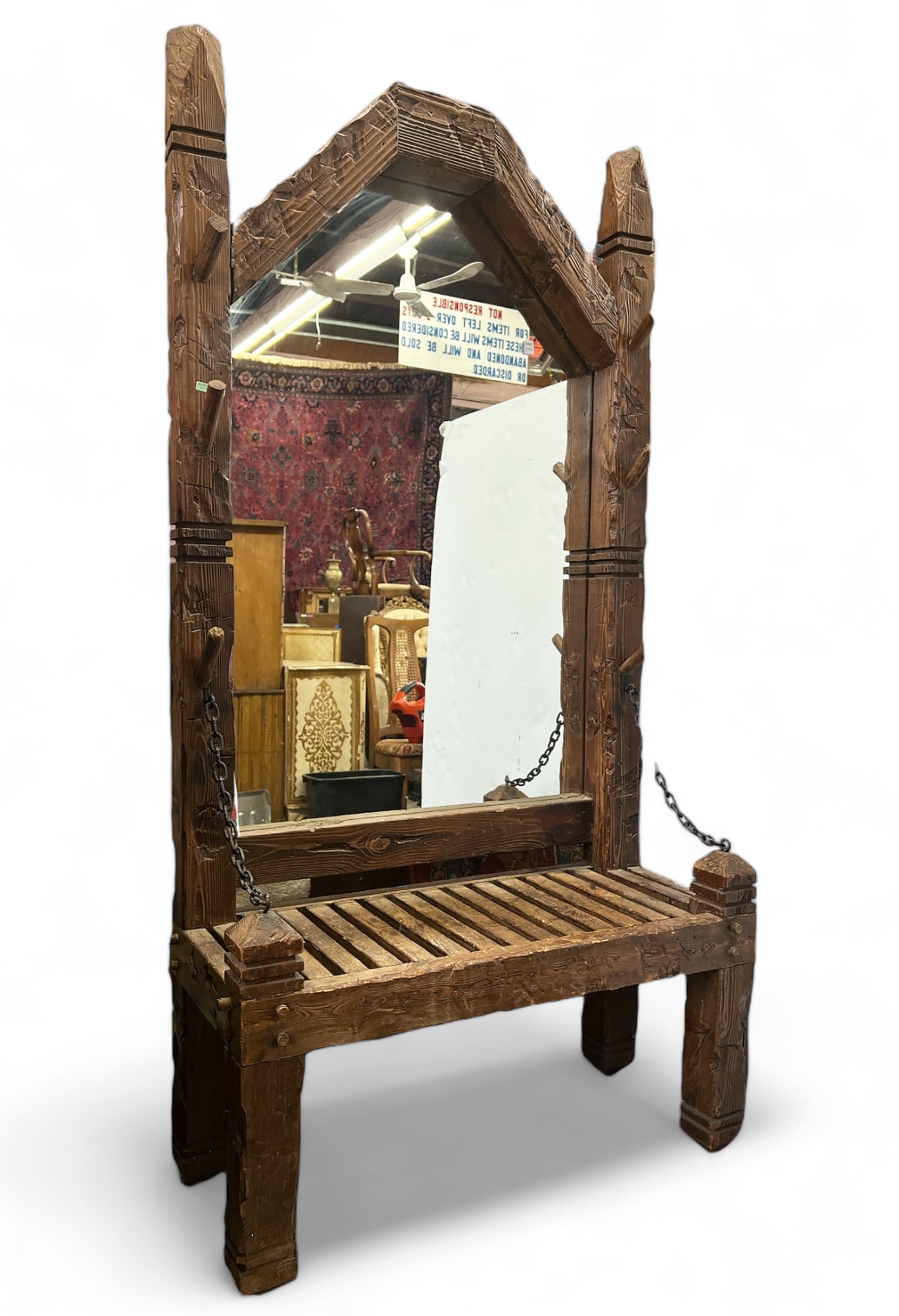 Primitive Hall Bench with Mirror.: This piece has a mirrored back, wood spikes/pegs, chains, and a slatted seat. There are some indentations and scratches, but overall it is in good condition. It measures 36" wide, 17" deep, and 72" ta