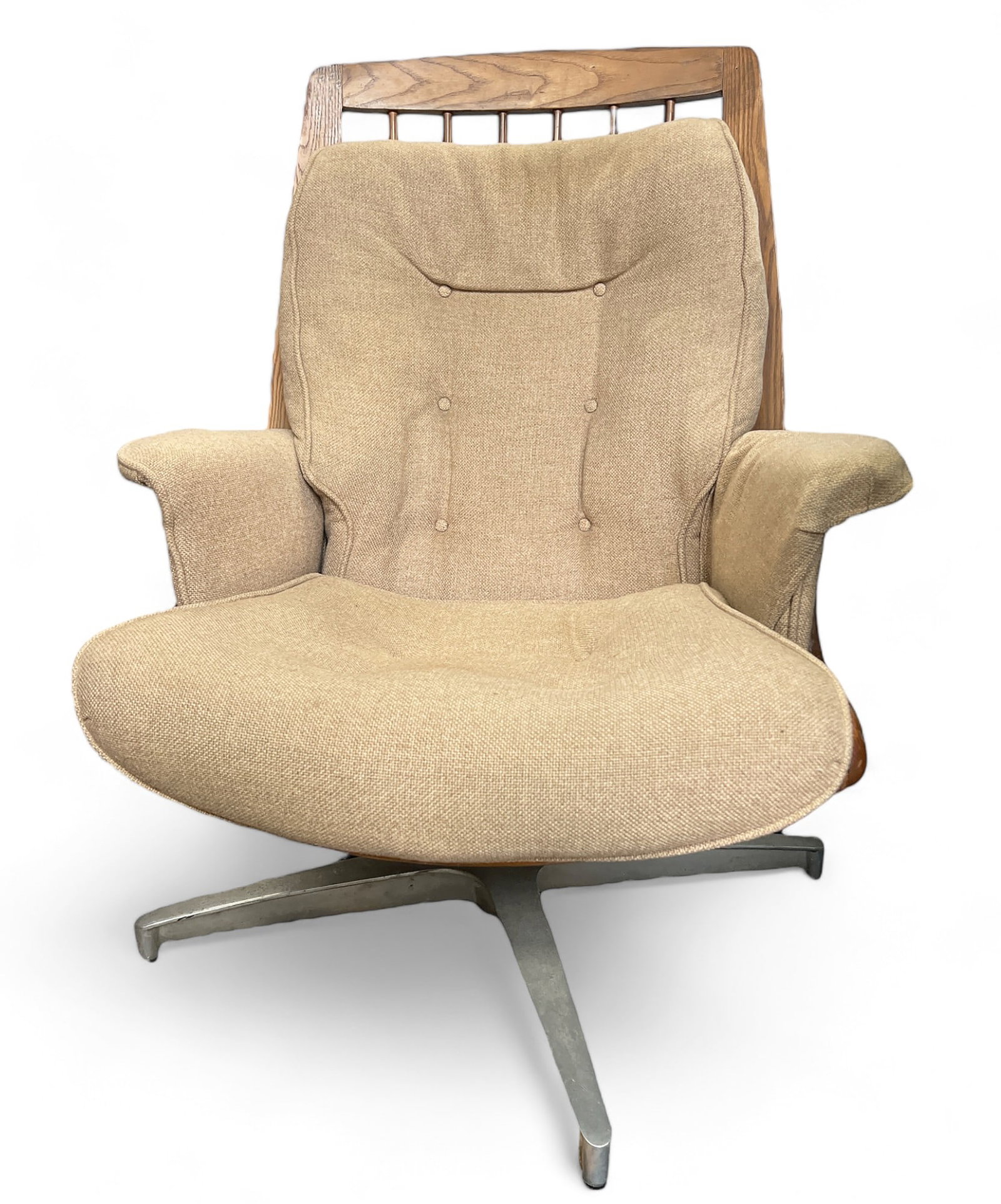 Mid-Century Modern Heywood Wakefield Lounge Chair: The chair tilts, swivels, and rocks. It has a teak contoured frame, and both the seat and back cushions are removable. The backrest has two metal supports or brackets. There are a few dirt spots on th