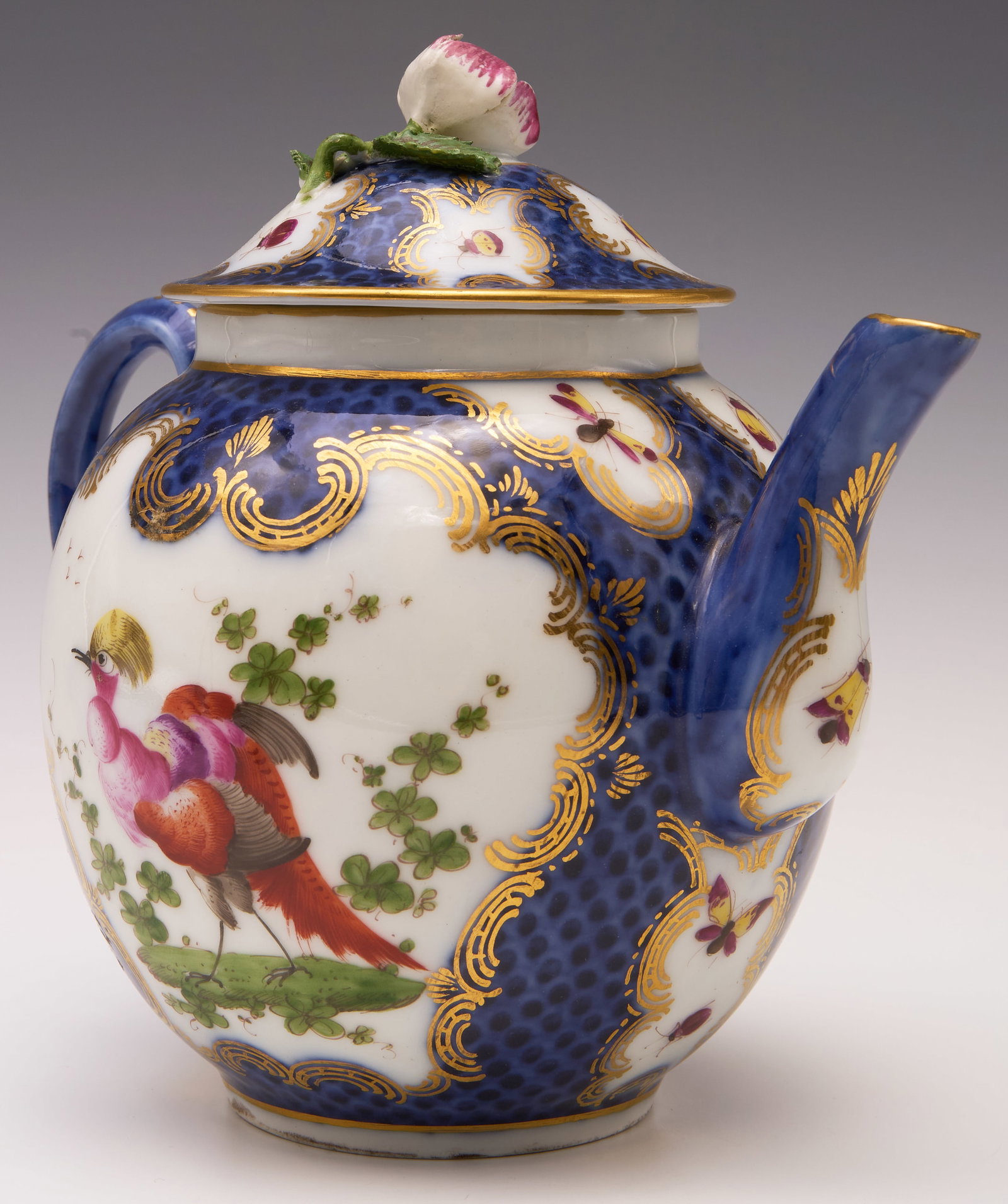Royal Worcester 18th Century Exotic Teapot.: It is marked on the underside. This blue and white teapot is decorated with colorful birds, various insects,an applied flower finial, and painted gilded designs. There is some minor gilt loss; overall