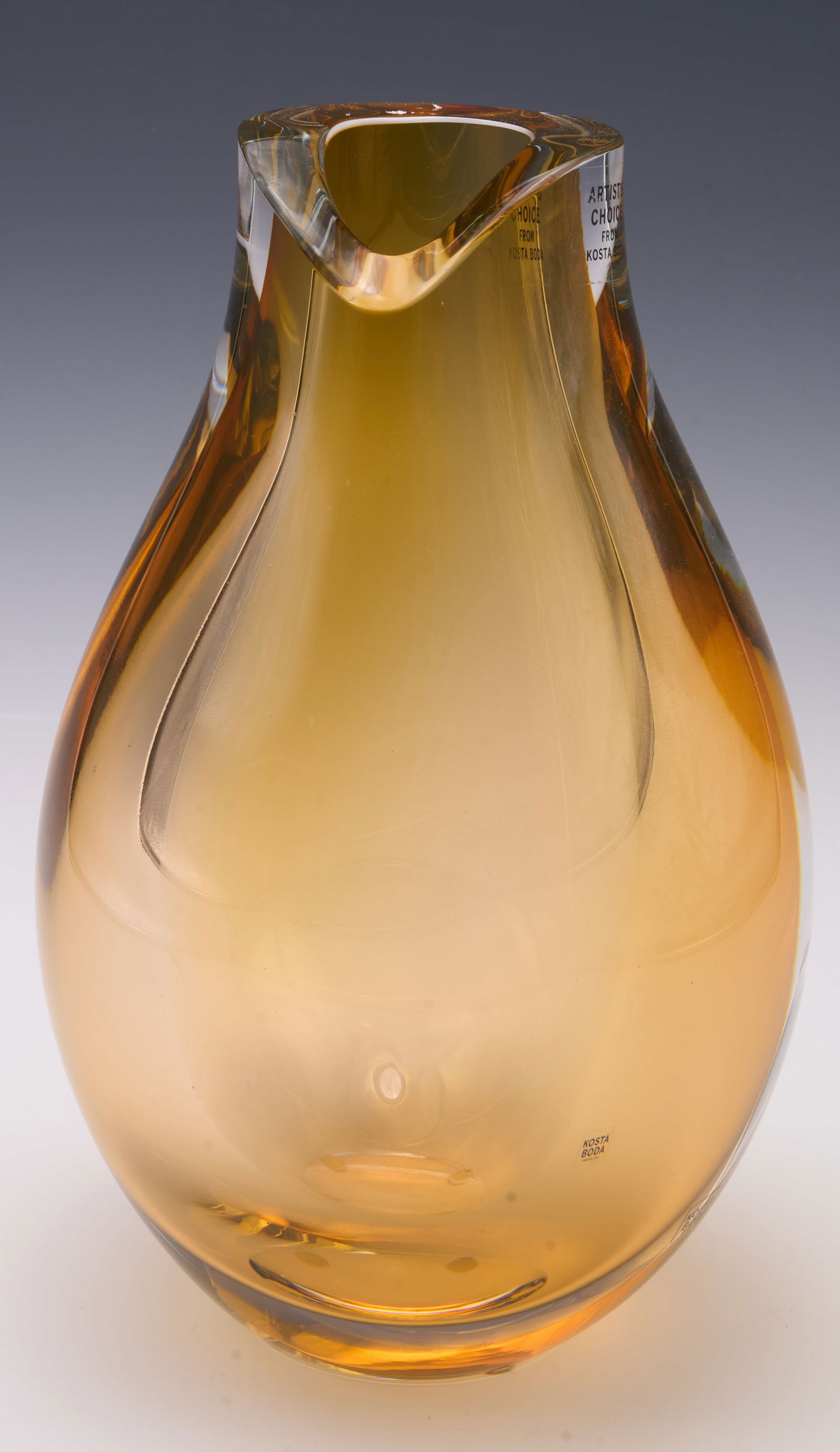 Kosta Boda Artist's Choice Vase- Goran Warff.: It is signed underneath. This amber-colored pear shaped vase is fairly thick and heavy. It looks to be in very nice condition. It measures 8 5/8" tall. In-house shipping is available. Please see our w
