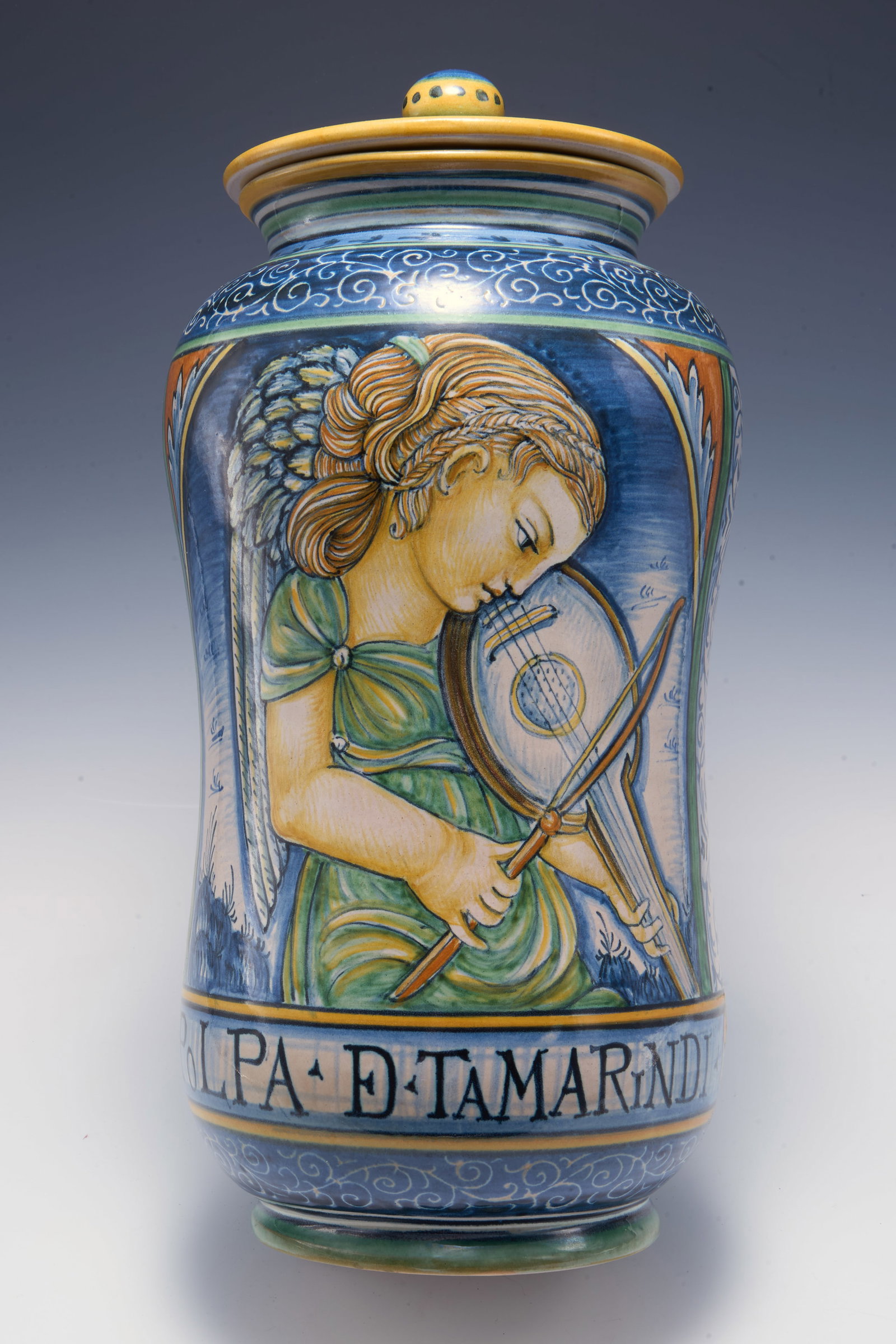 Deruta Italy Covered Jar w/ Violinist.: It is signed by artist Antonio Margaritelli. Both the lid and the jar look to be in very nice cosmetic condition. With the lid on, the entire piece measures 12 3/4" tall and 6" across the widest area.