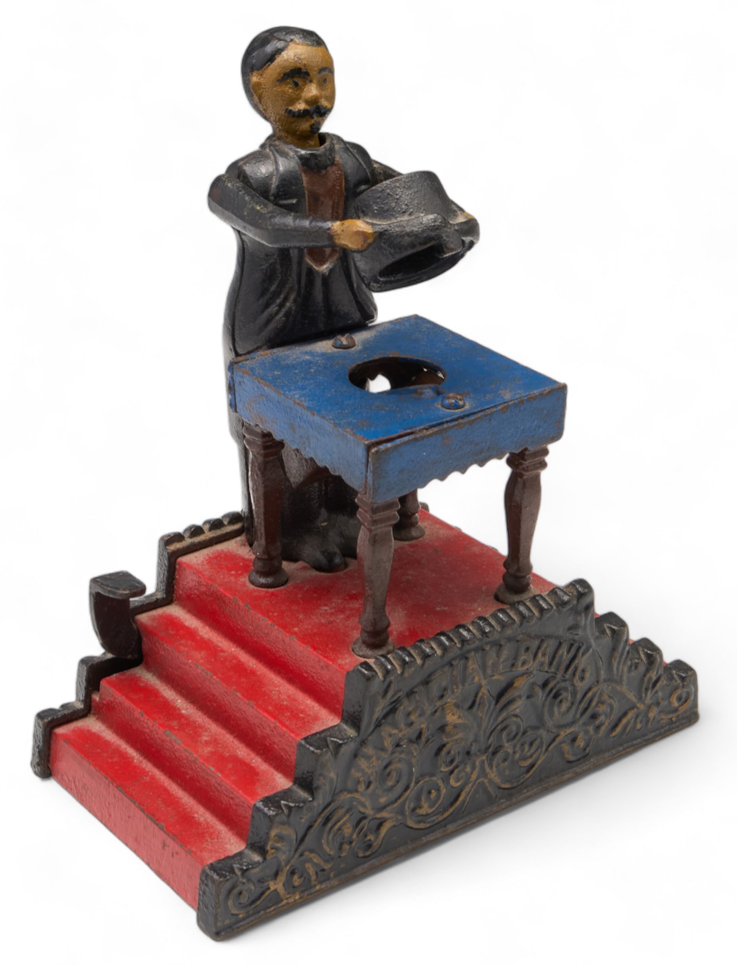Magician Cast Iron Mechanical Bank J.&E. Stevens.: This antique piece is marked on the vase with the patent information (Pat. Jan. 1901). It has been repainted as the steps are painted a red, the table is blue, and the rest is black with some details.