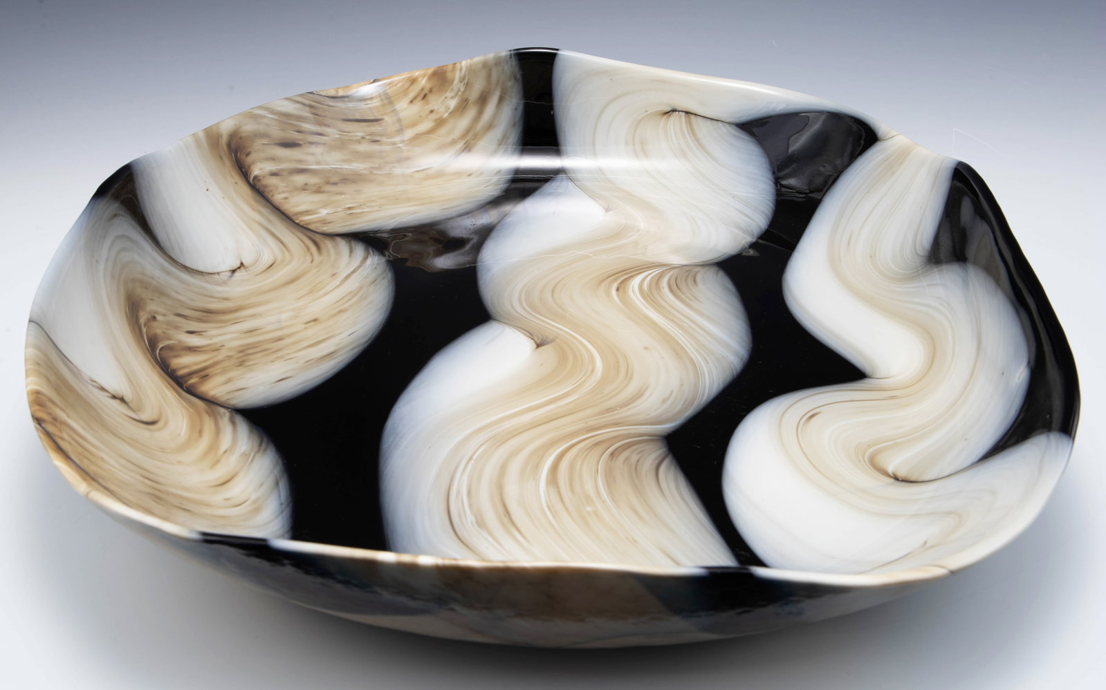 Yalos Murano Centerpiece Bowl.: It is signed on the underside. The bowl has white and tan squiggles against a black background. The center has some scratches; overall, the bowl looks to be in good cosmetic condition. Its measurement